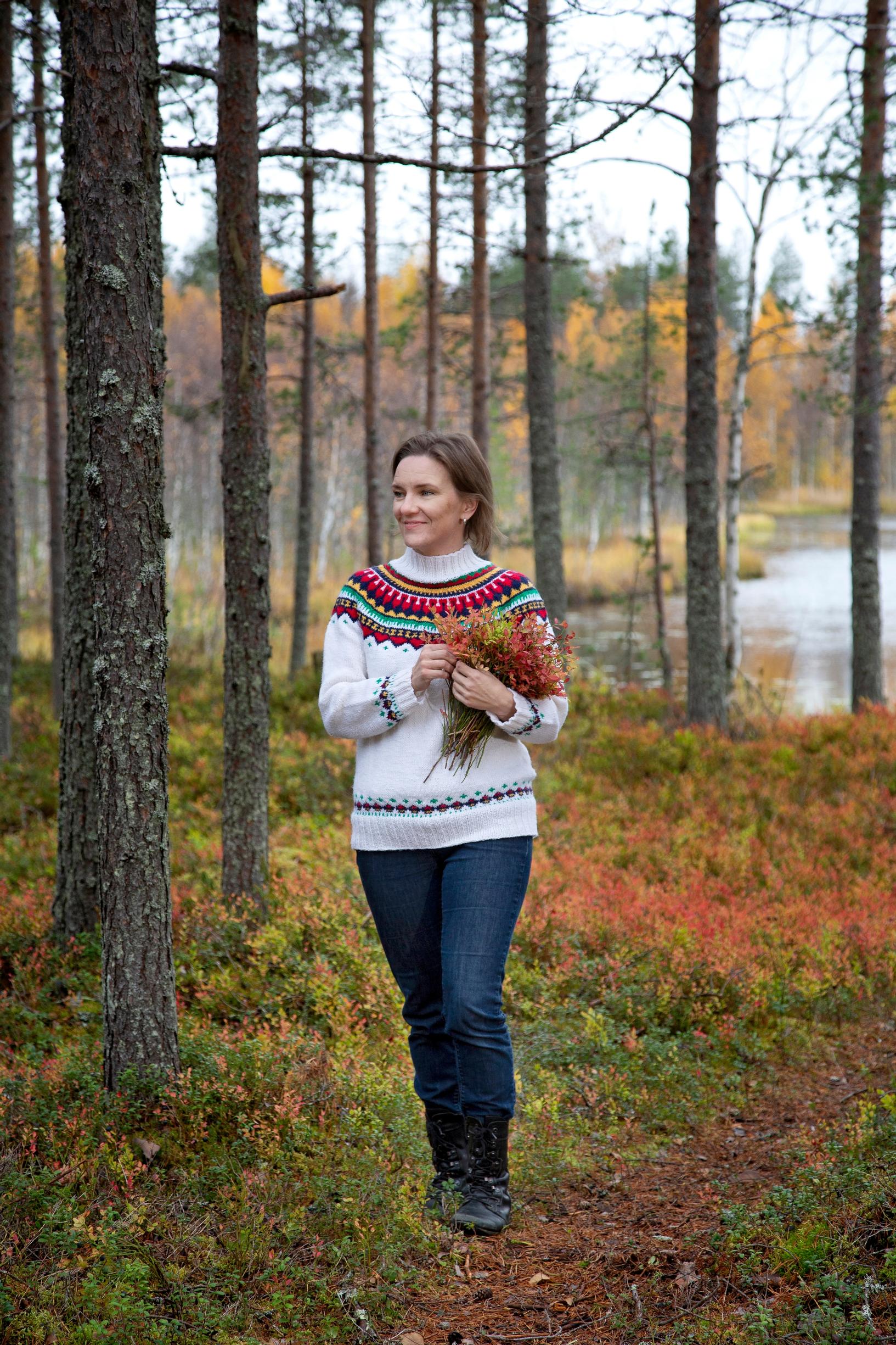 Woman walking in an autumn-colored forest