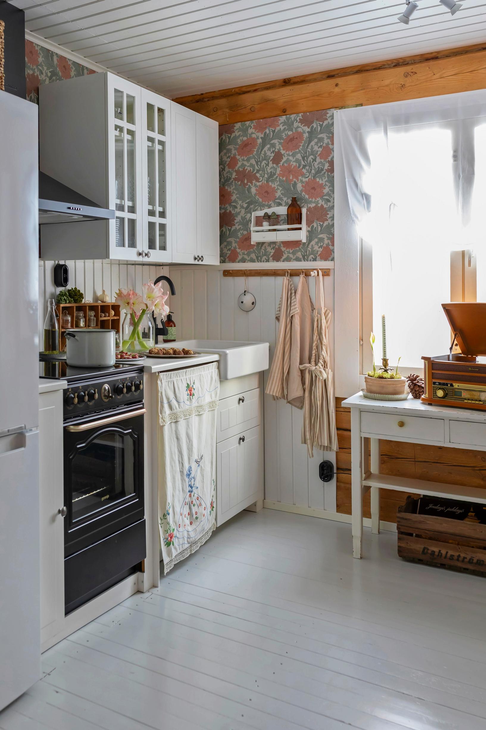 A kitchen with a towel blanket in front of the dishwasher