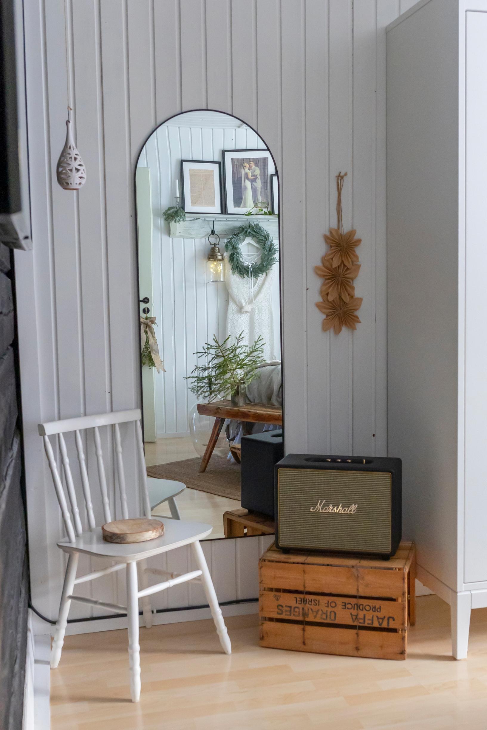 A curved mirror on the wall