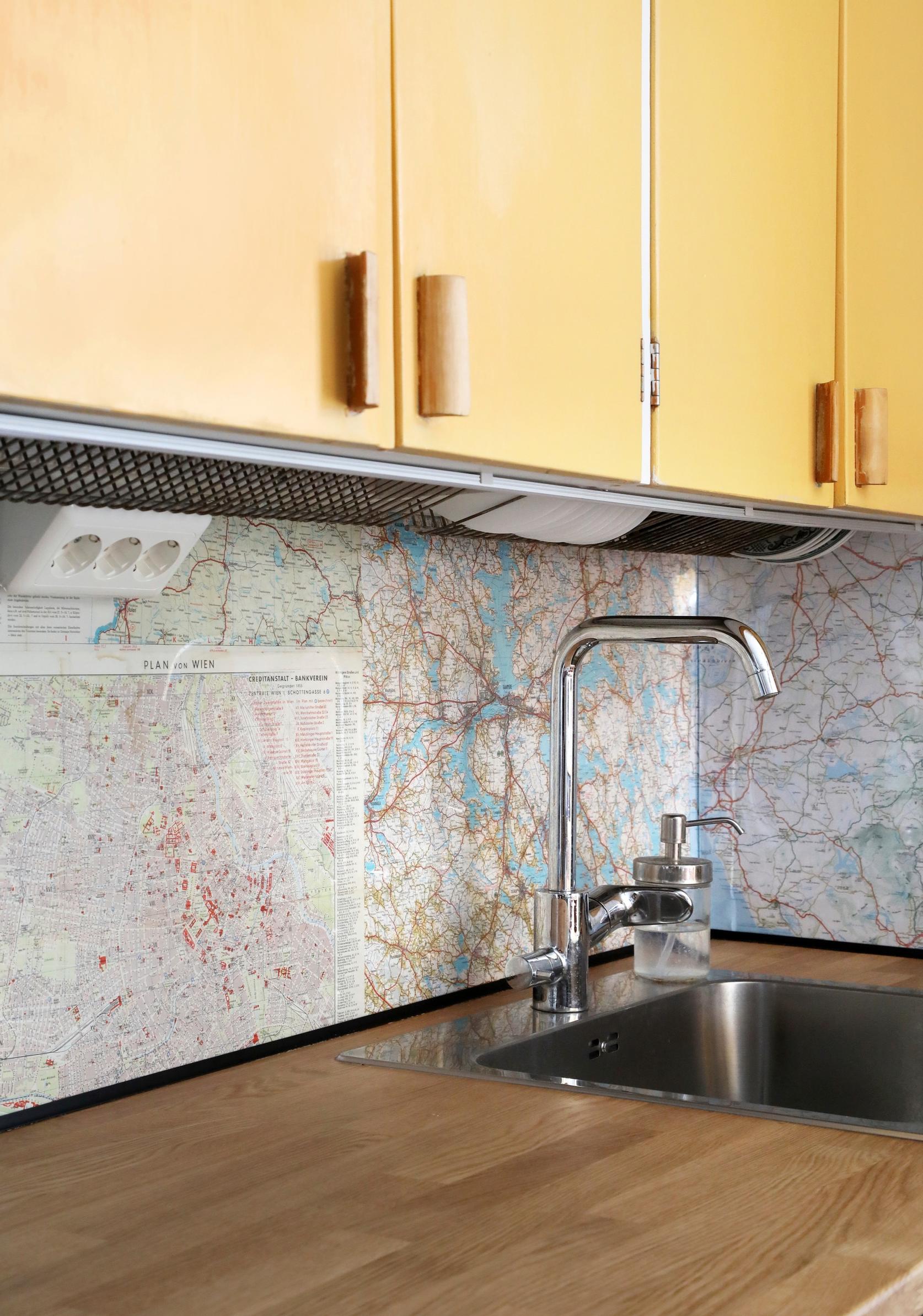 Map pages on the kitchen backsplash