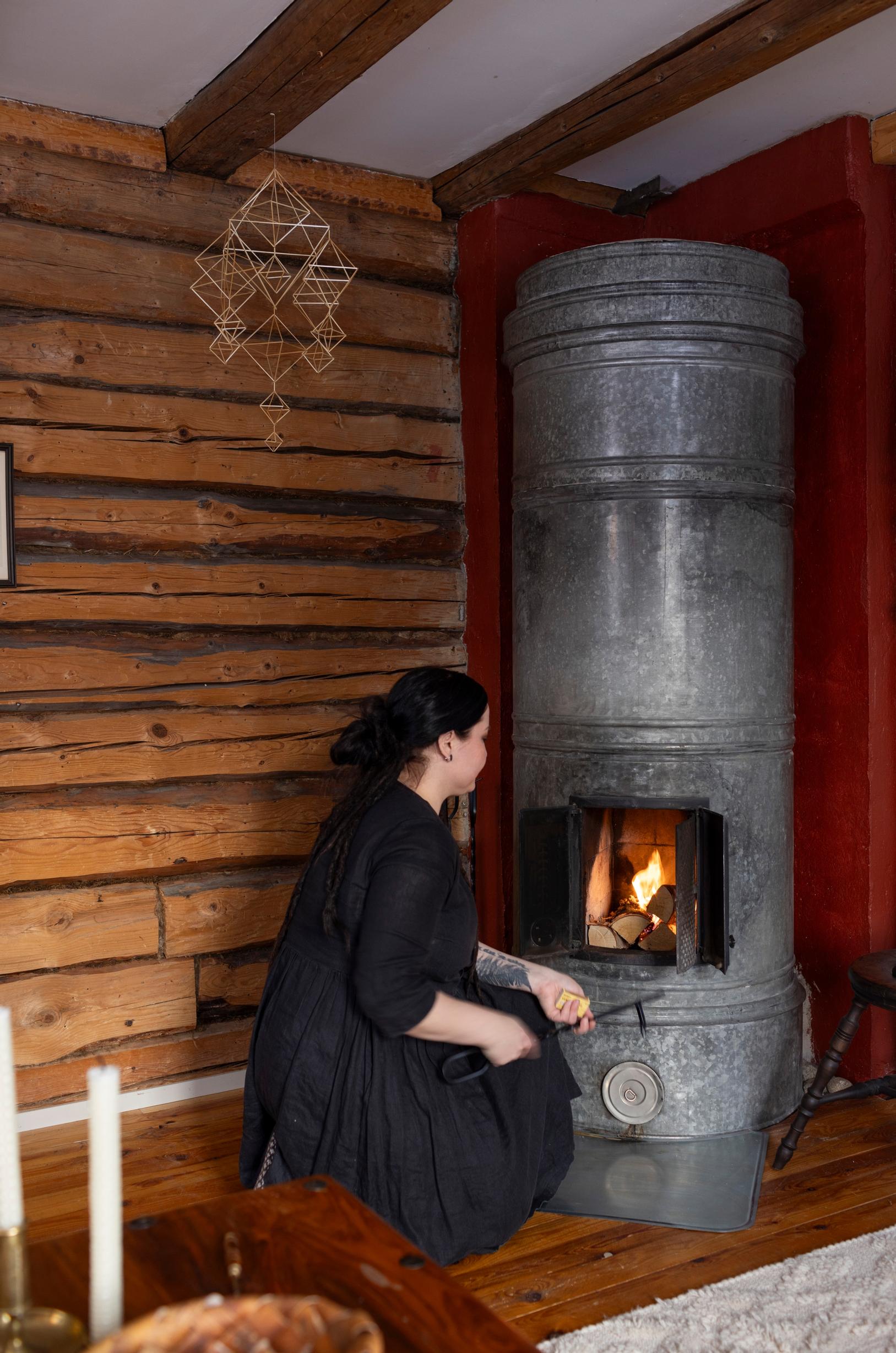 Jenna Pigg lighting the stove