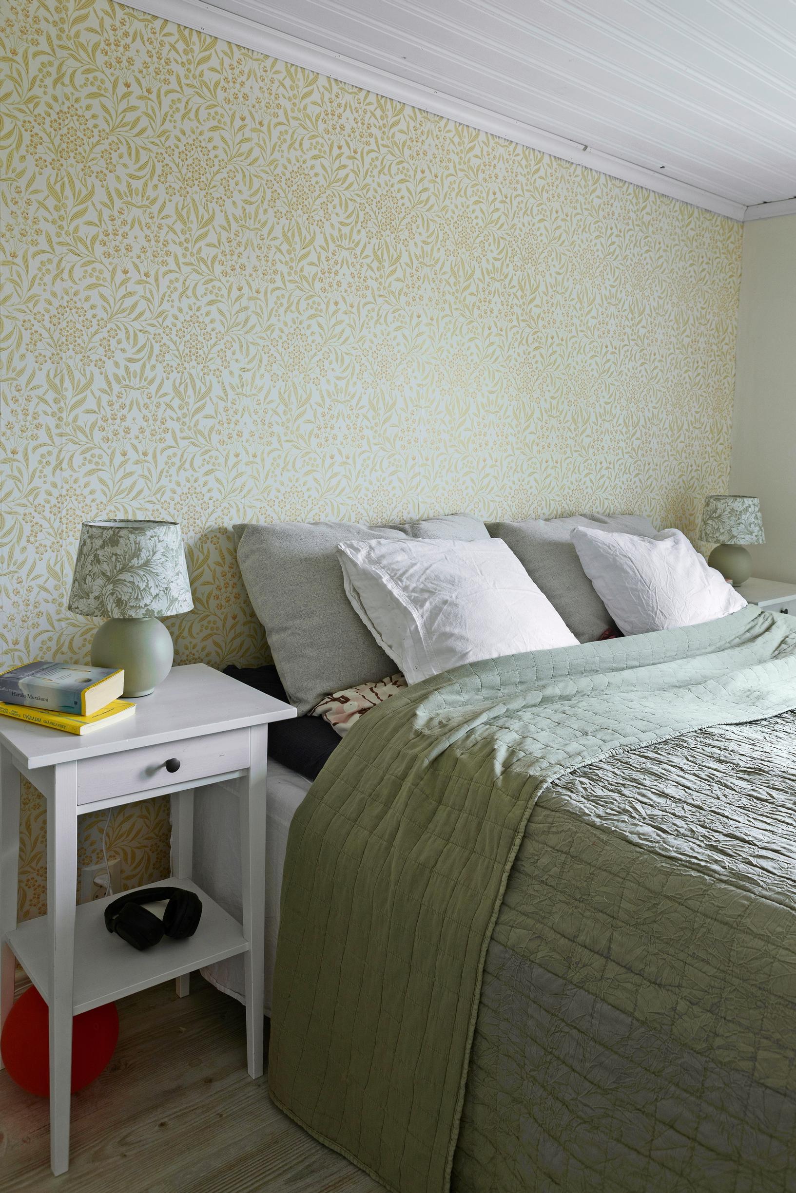 A photo of a green-toned bedroom.