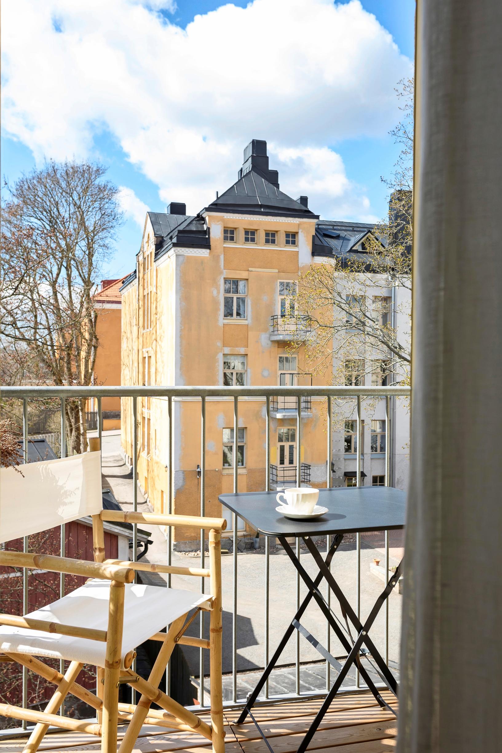 A small balcony with a city view