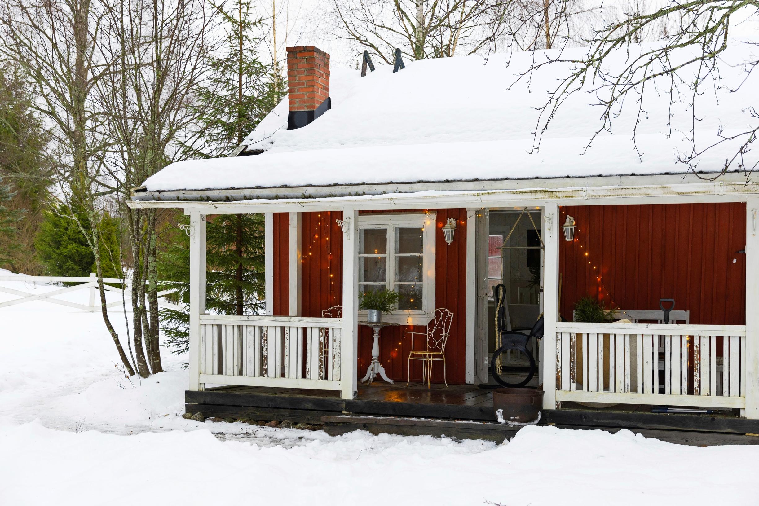 The lakeside cottage in winter attire.