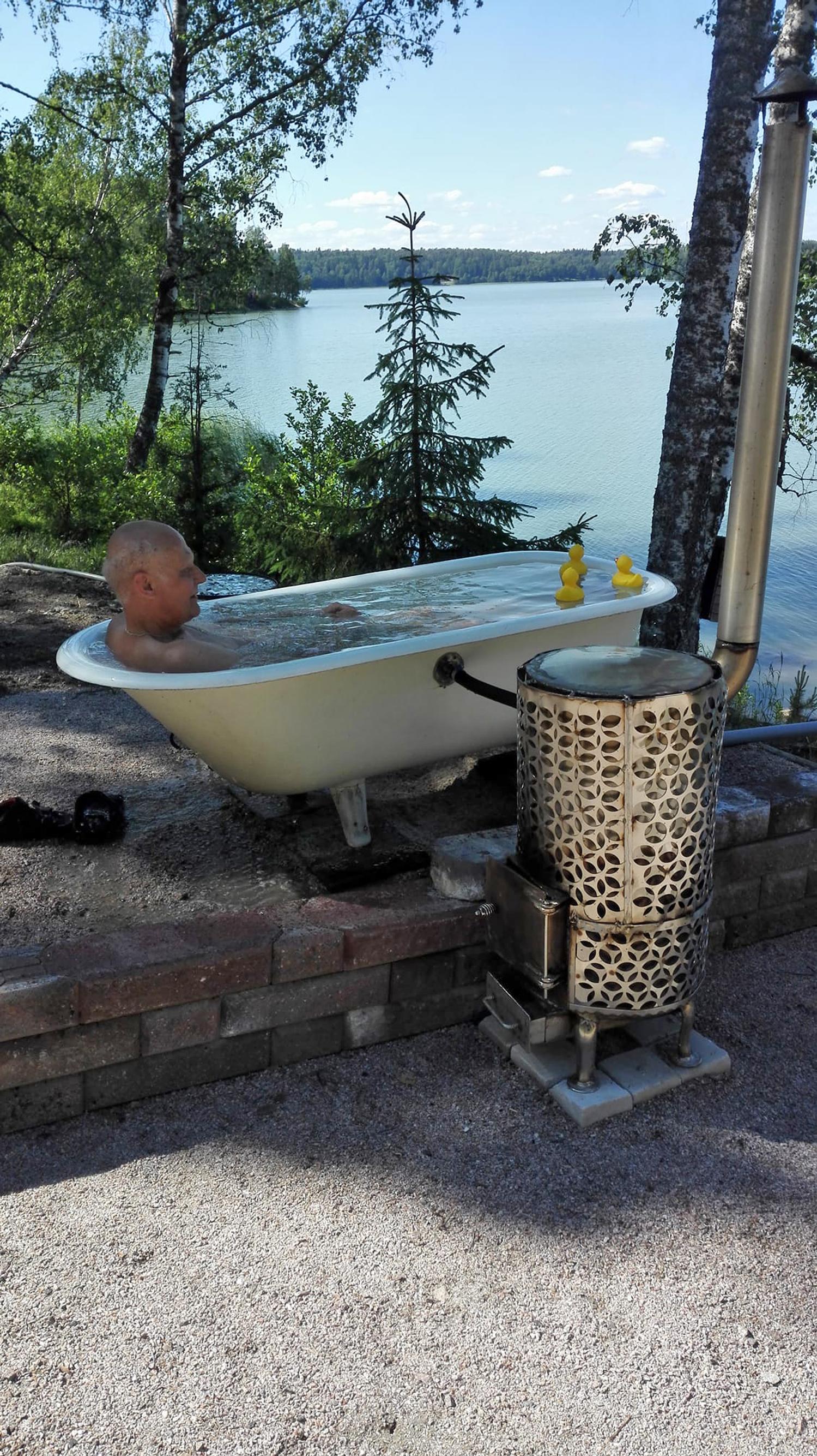 A hot tub from an old bathtub! Sol-Britt and Jussi built an eccentric soak spot heated by a wood stove