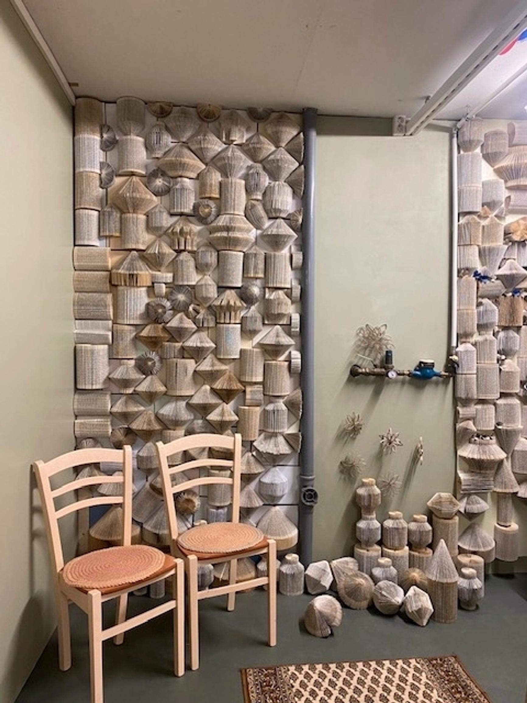 an acoustic wall made from folded books