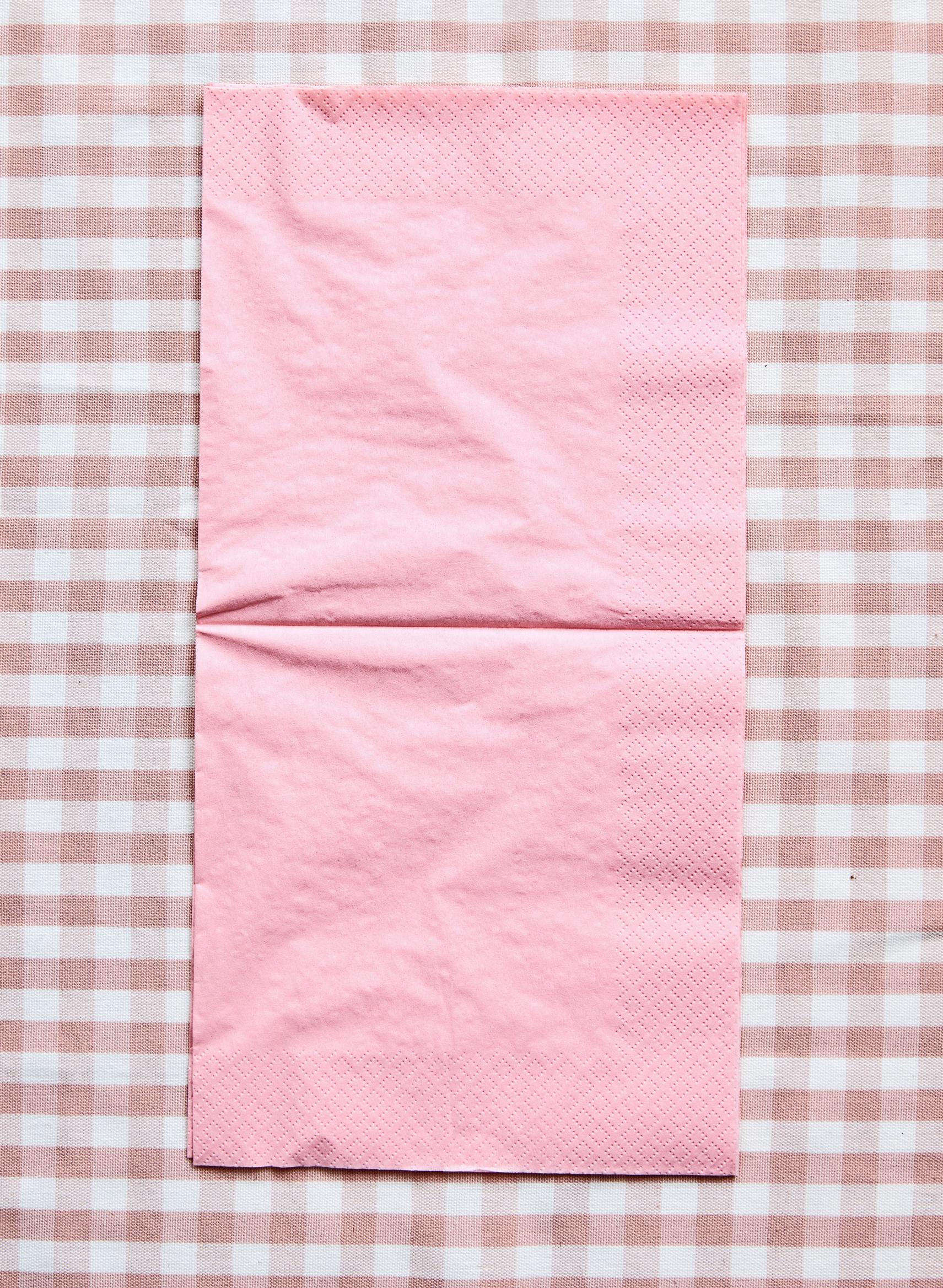 Two opened napkins on a table.