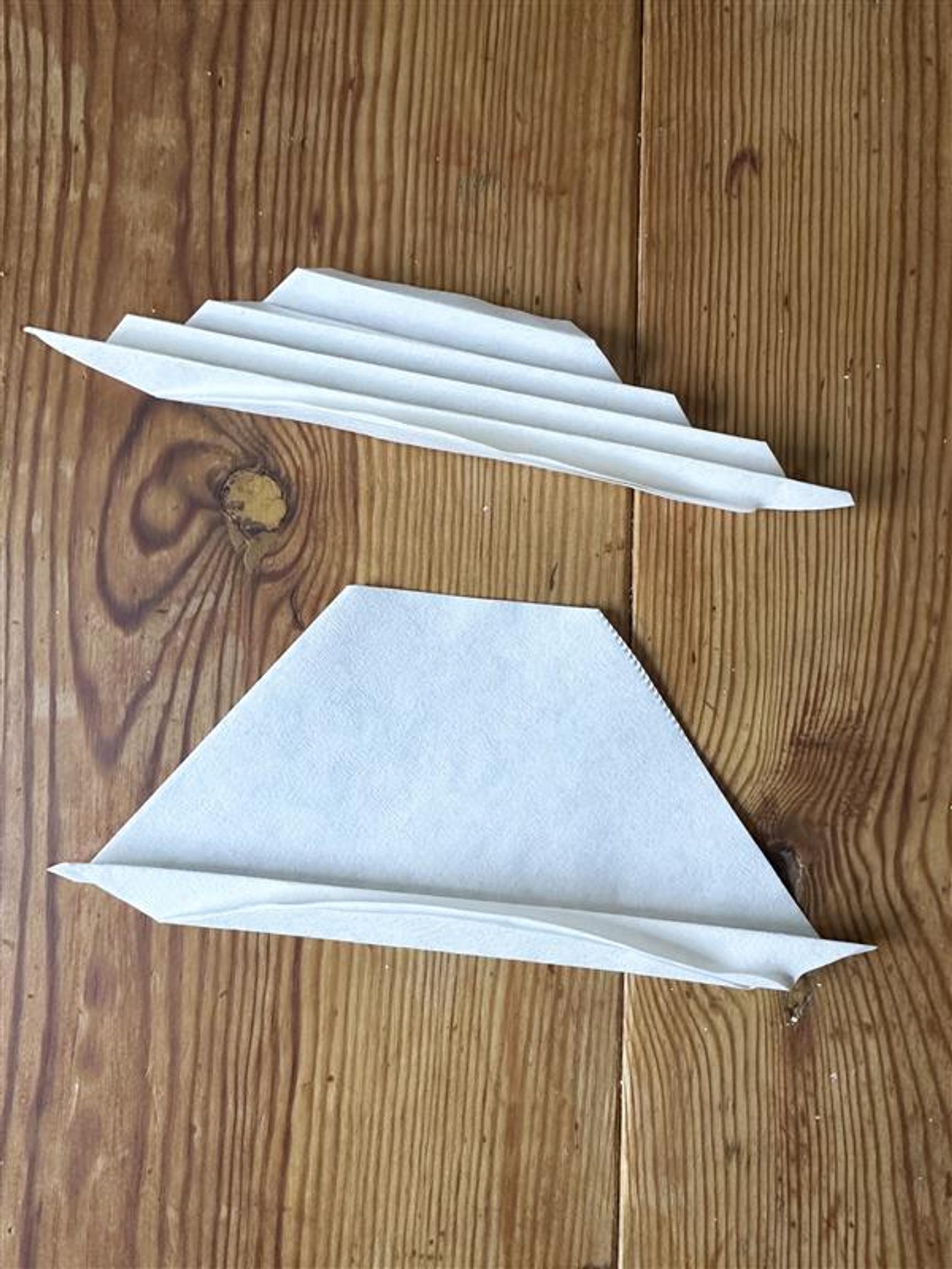 Folding the coffee filter into an accordion.