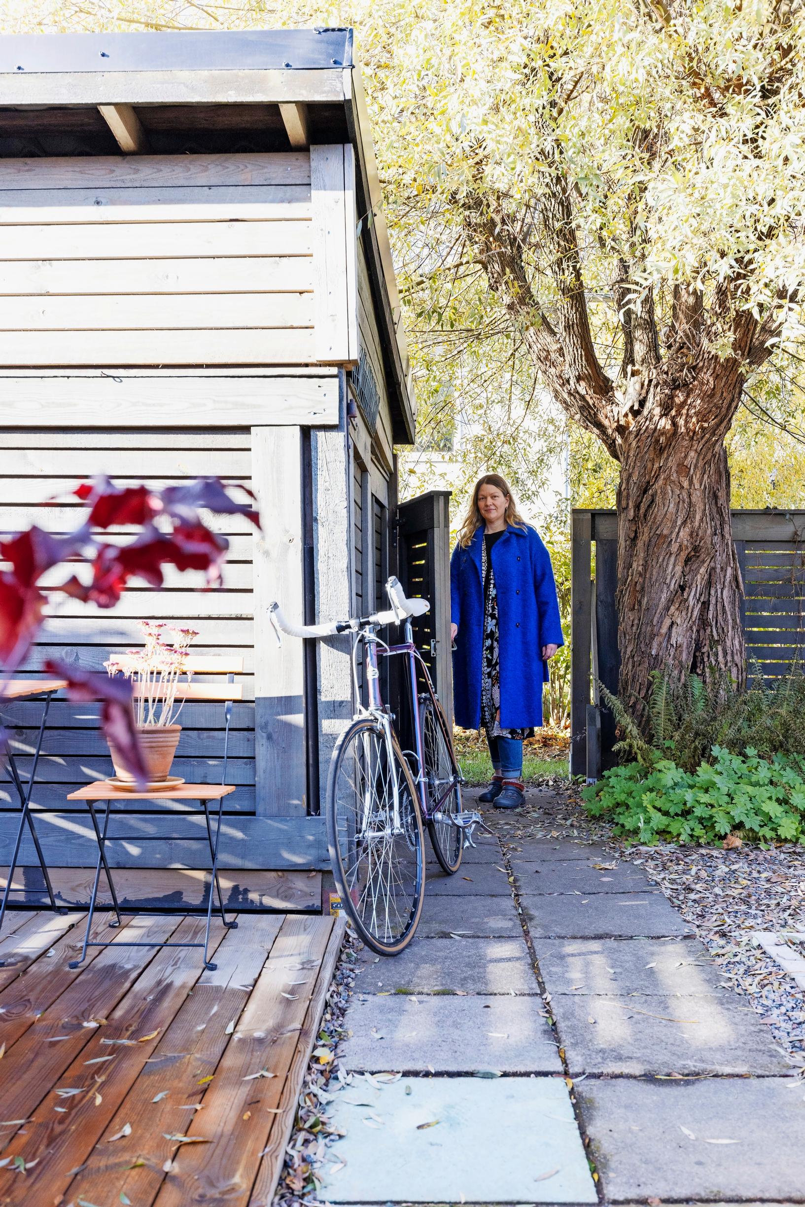 Liisa Laine walking in her garden