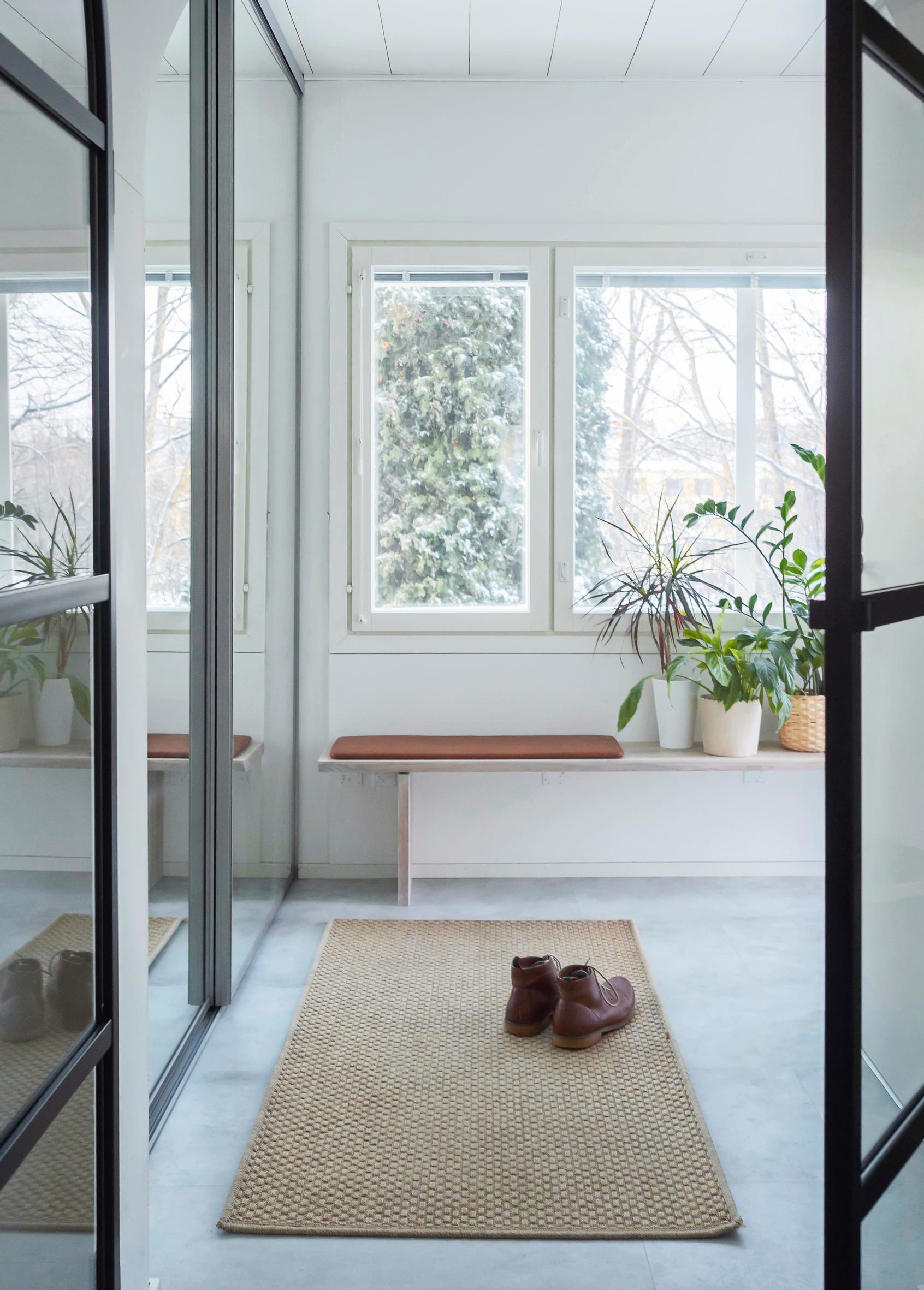 A wall-mounted bench in the entryway