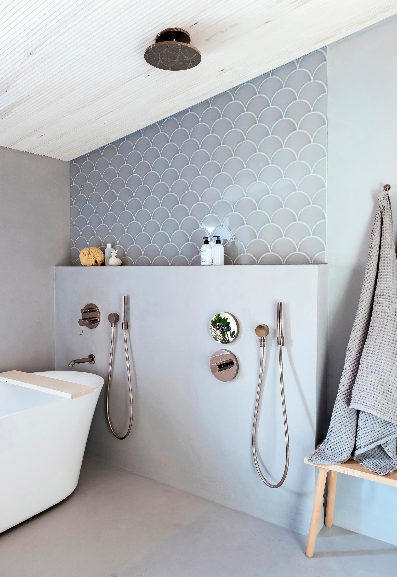 Bathroom with microcement walls and floor and hidden plumbing for the overhead shower