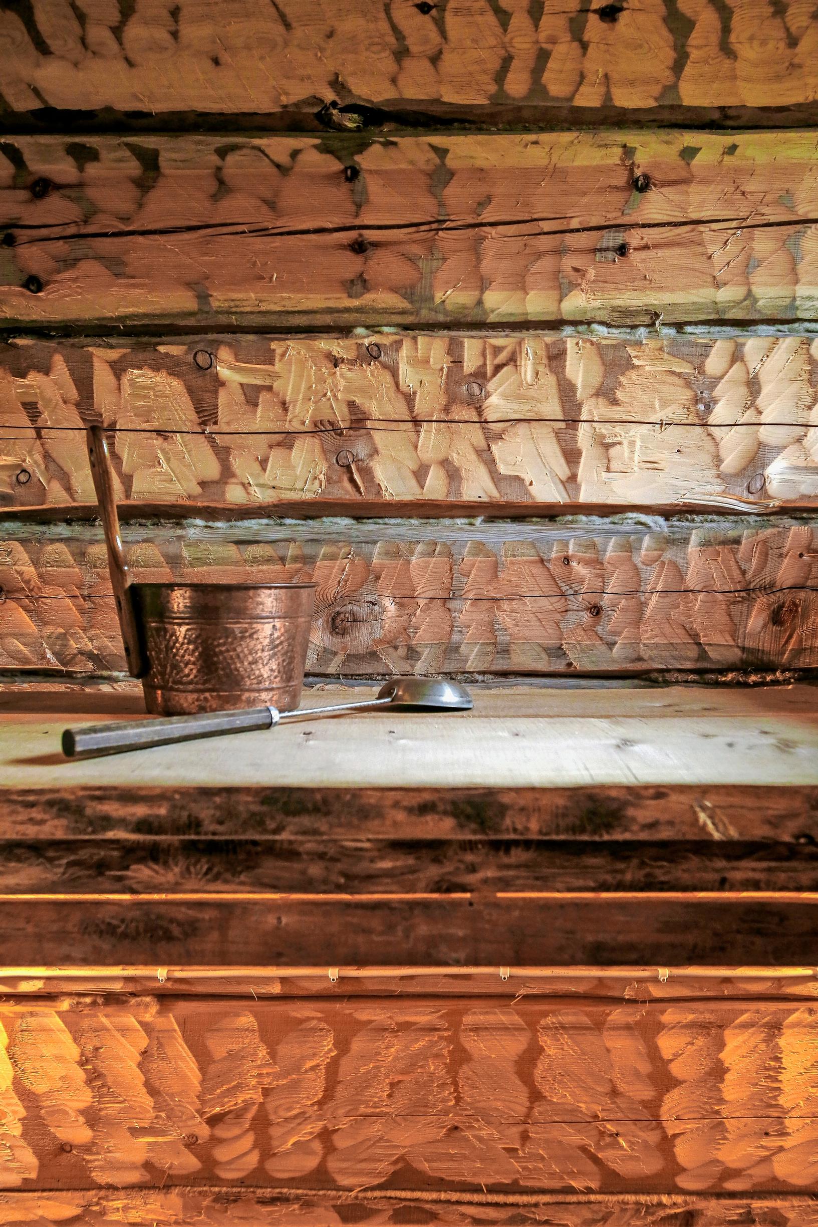 Unique saunas: sauna walls hewn and decorated with a broad axe