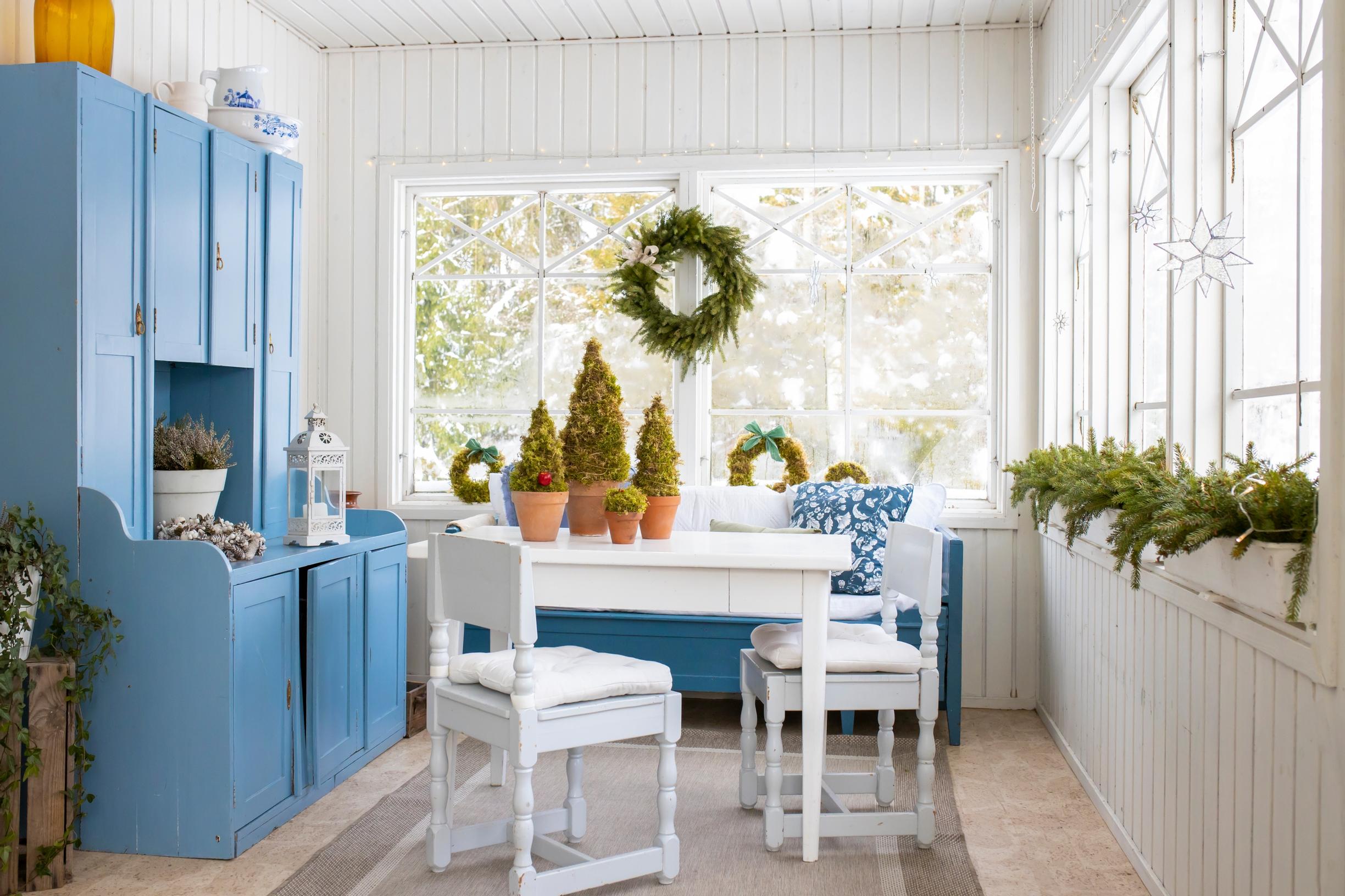 The glassed-in porch as a cool entry area.