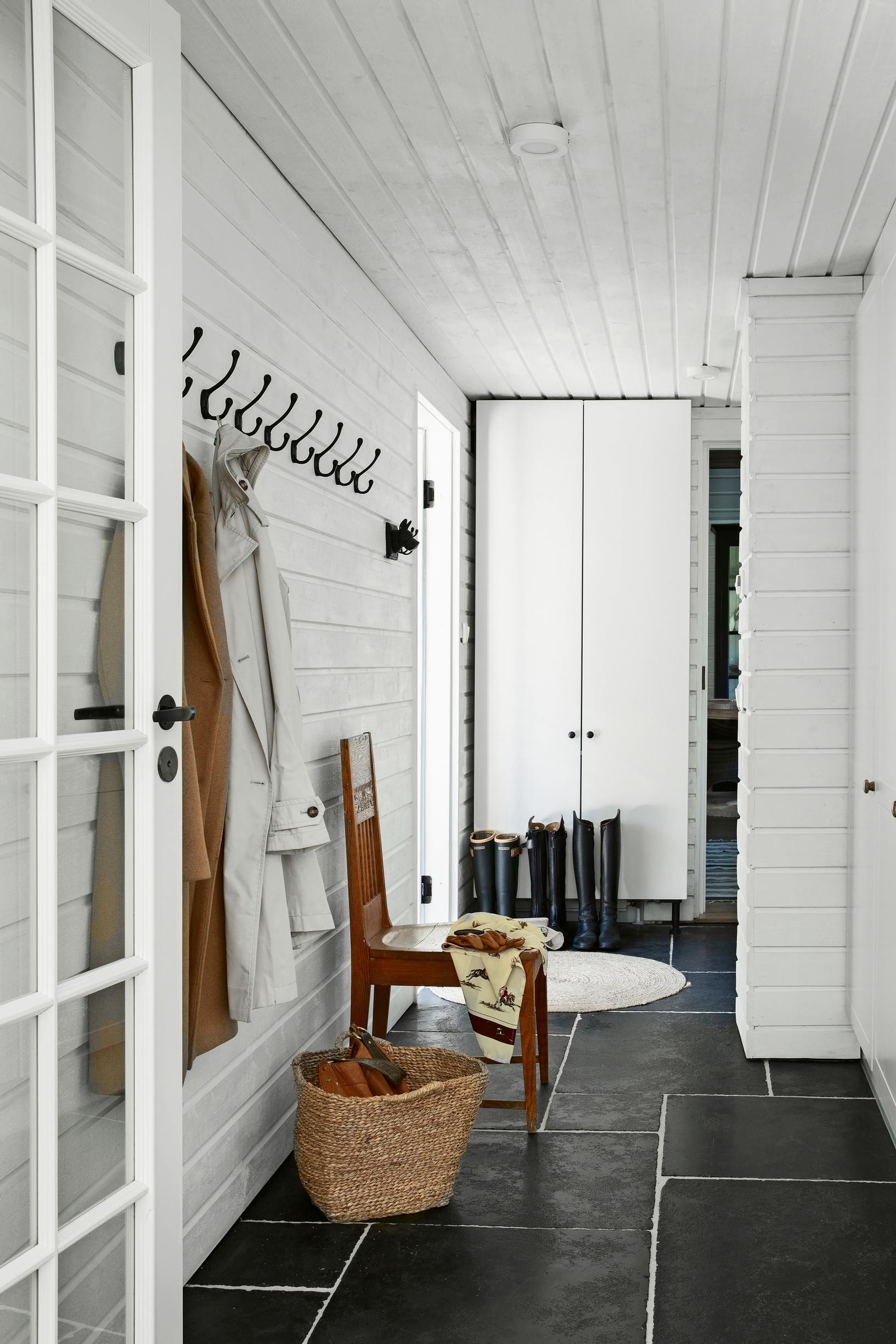 entryway with a brushed limestone floor