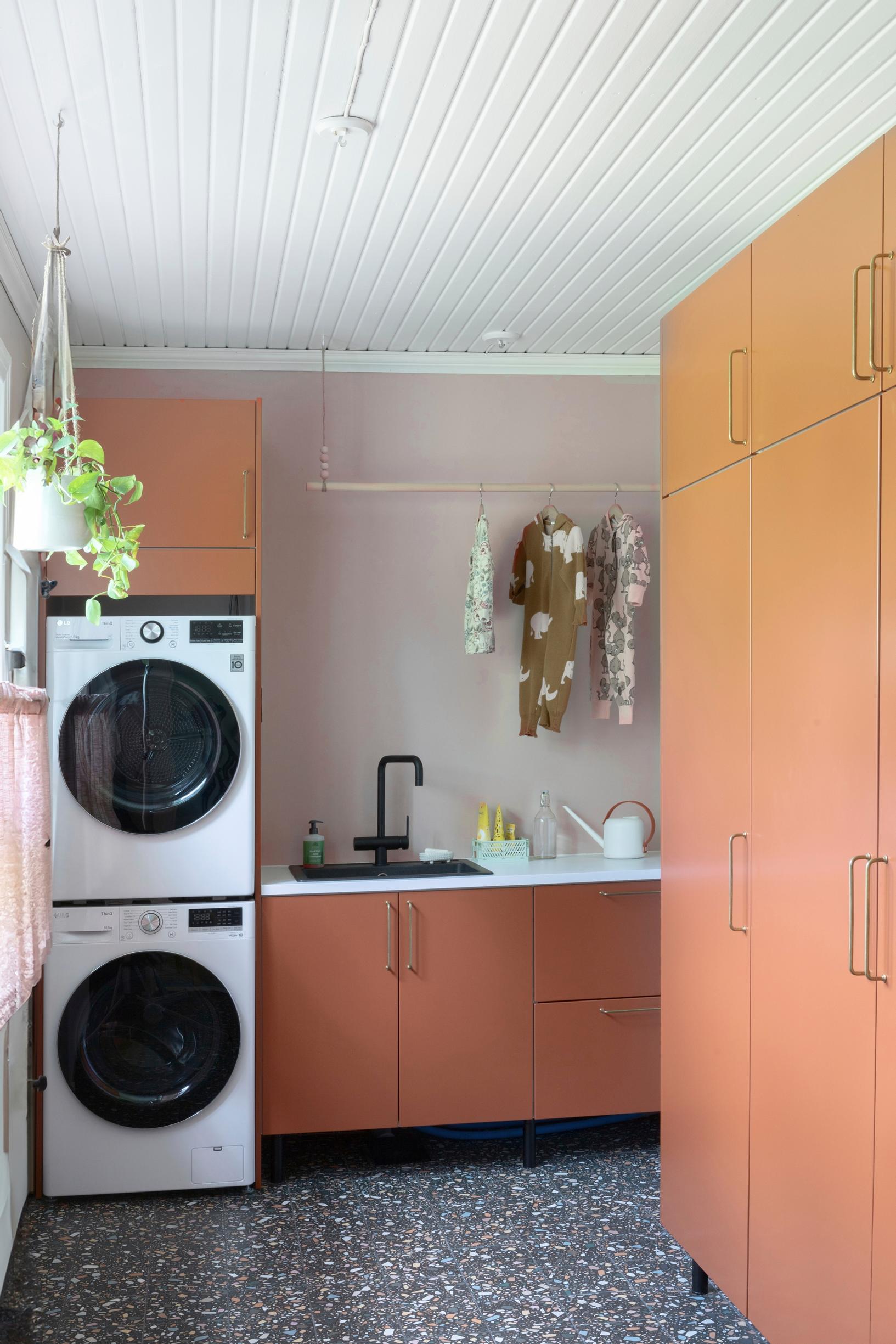 A colorful utility room and laundry tower