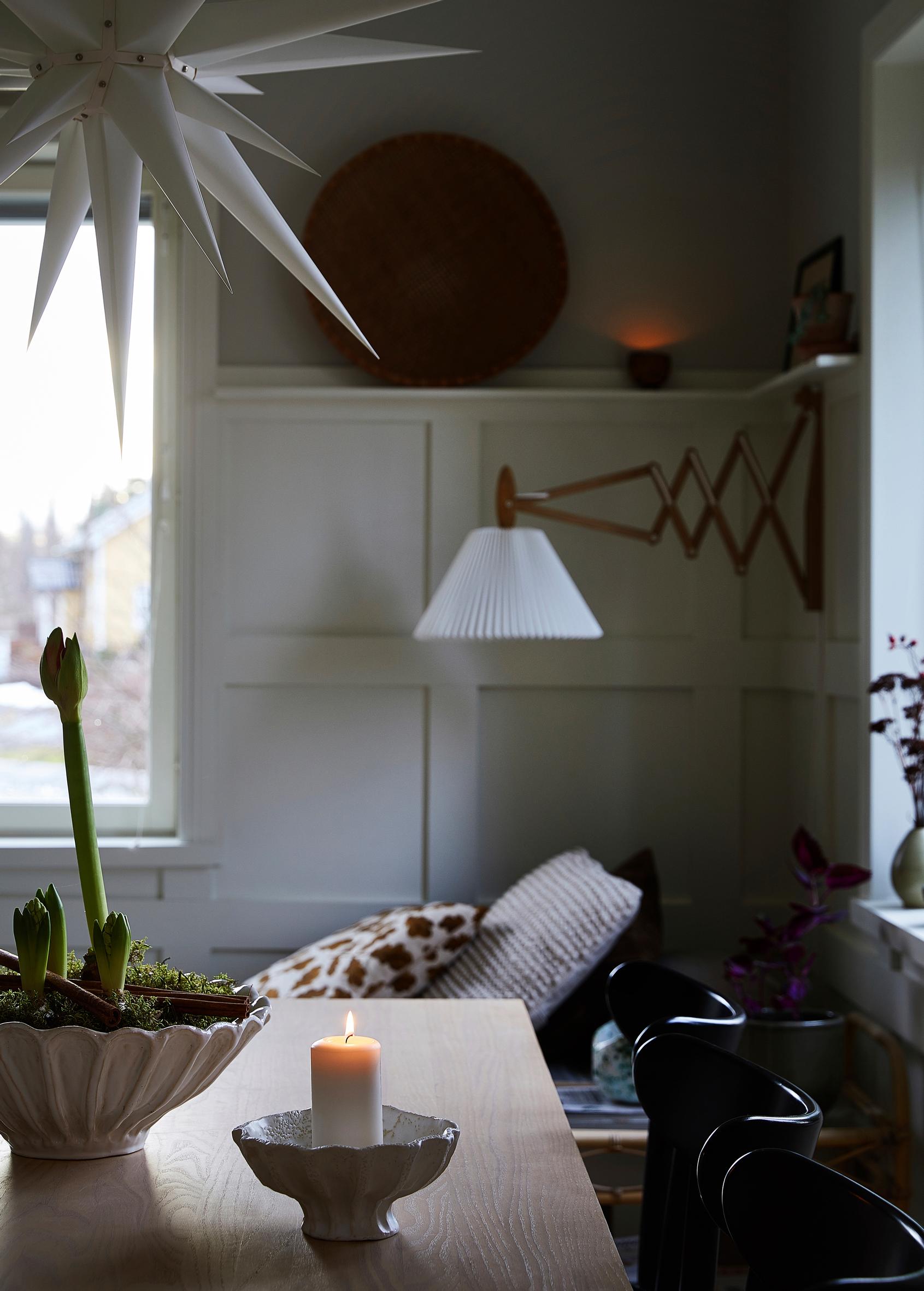 An ash dining table and black Ton chairs