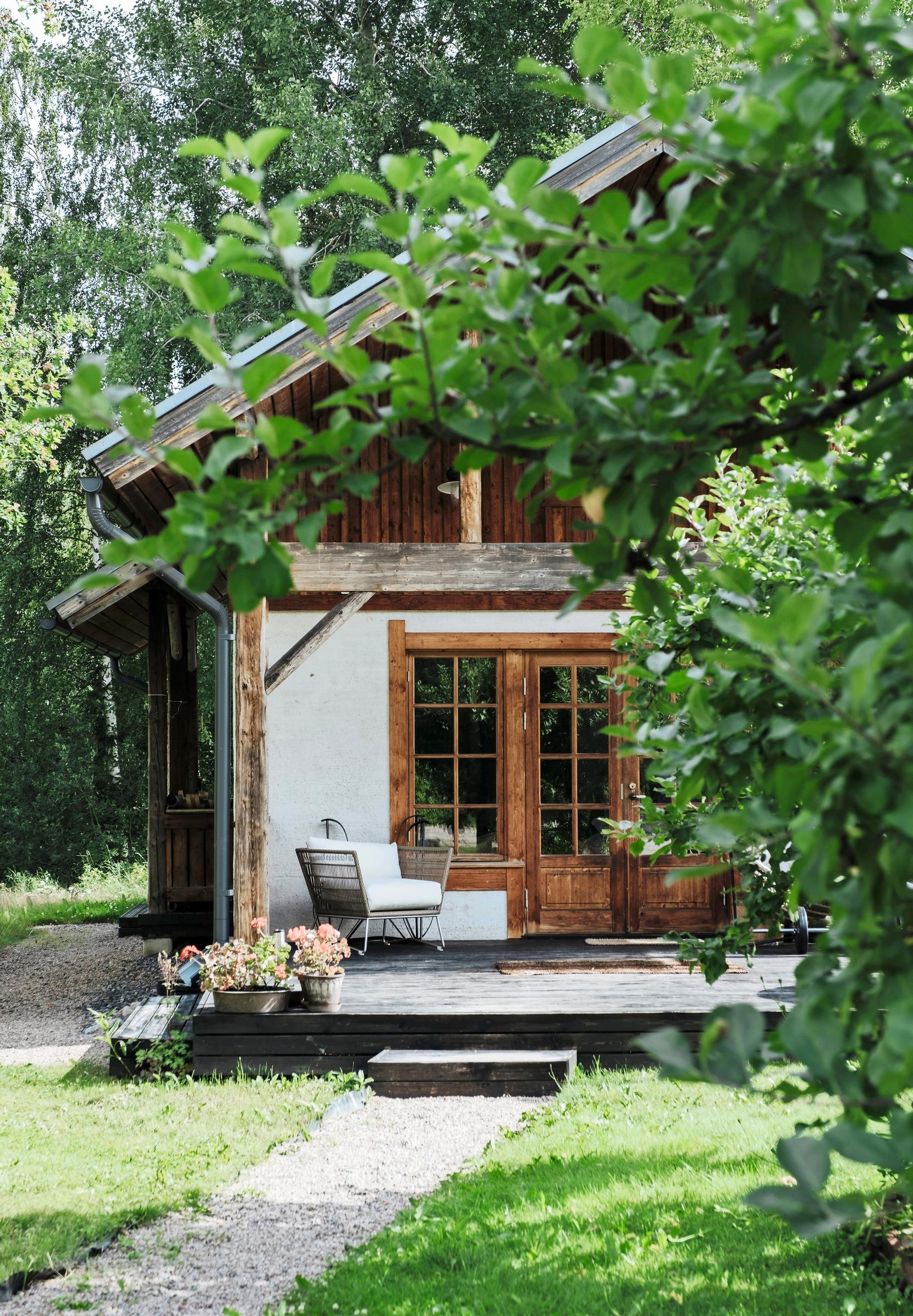 The lime-plastered outbuilding was the family’s first home on the property.