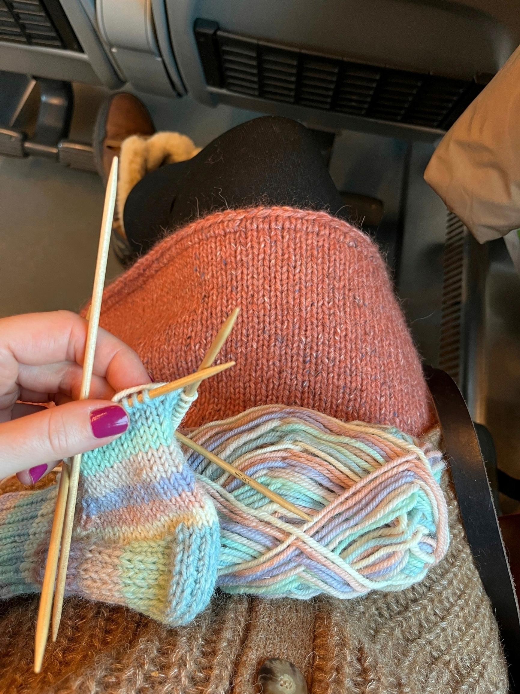 An unfinished wool sock in my lap