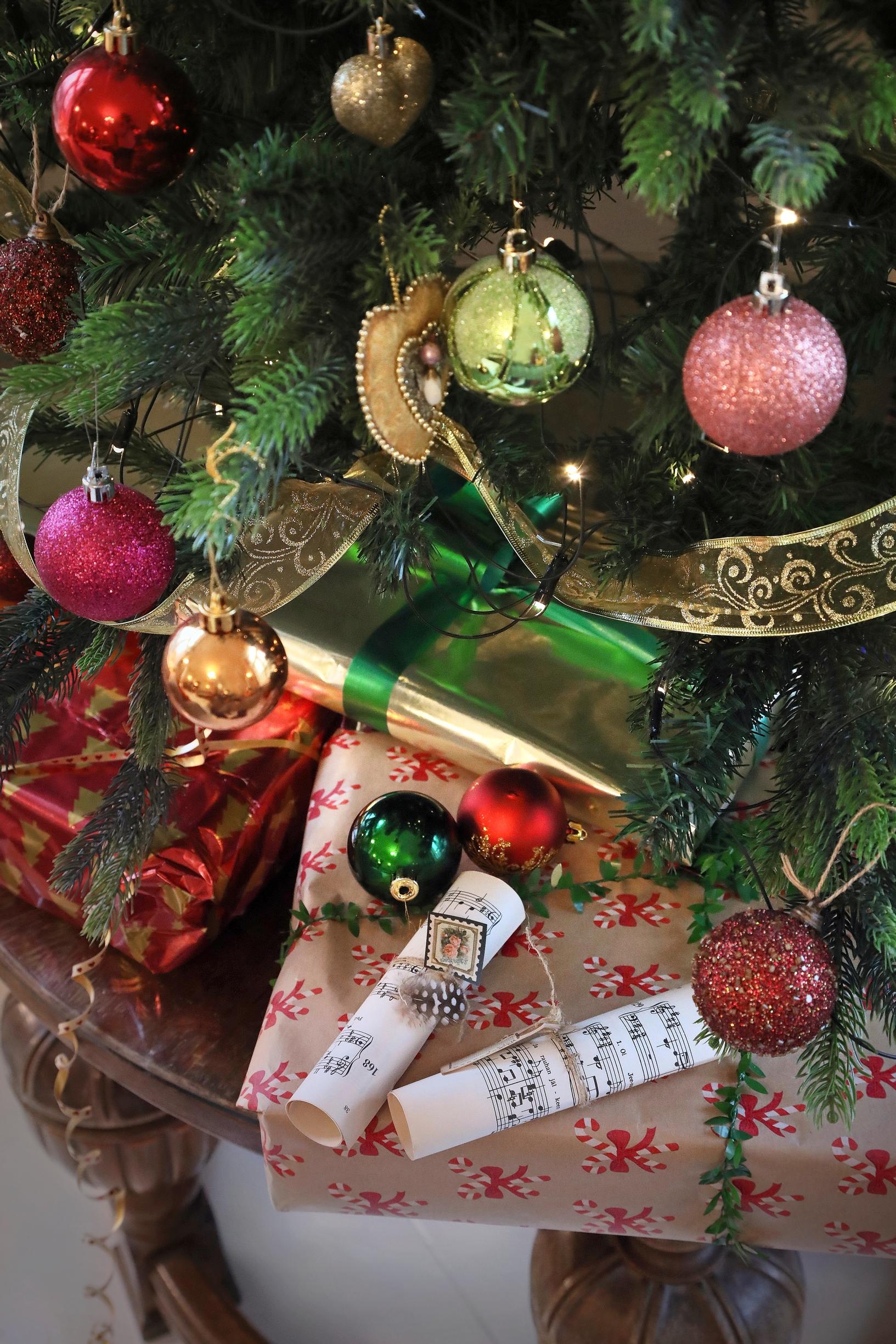 Christmas ornaments and gift packages under the tree