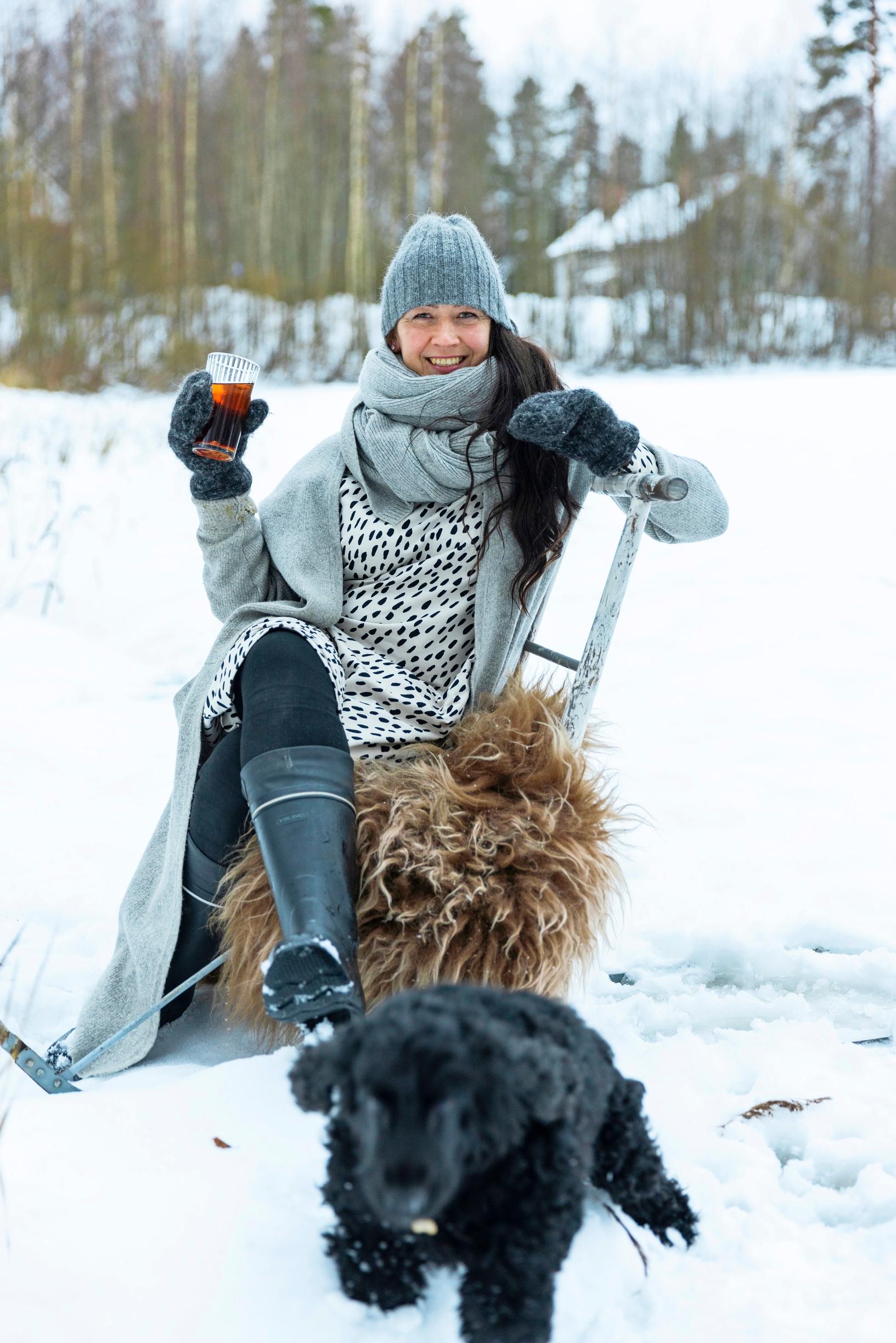 Minni on the ice with her dog.