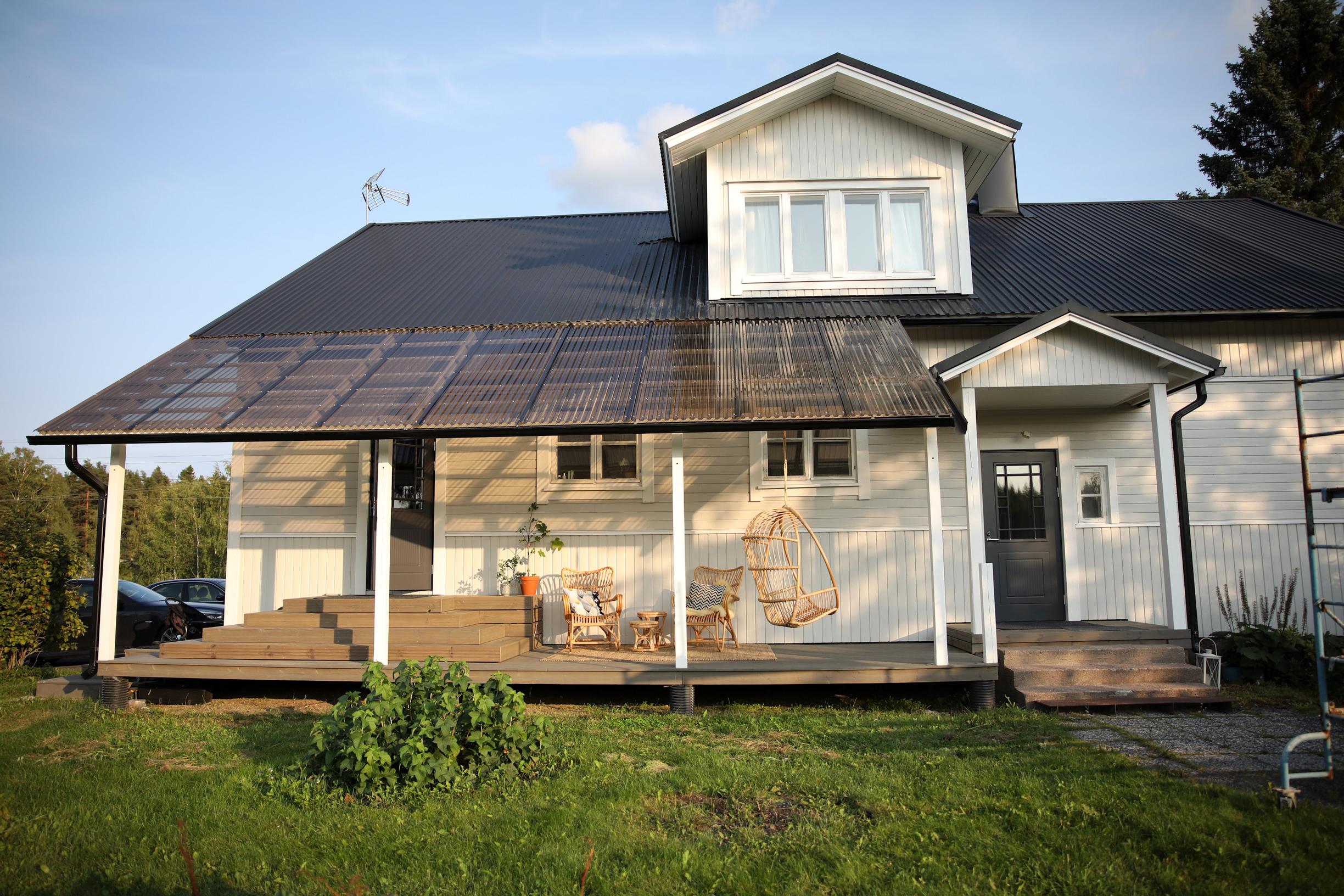 A large open deck in front of the single-family home