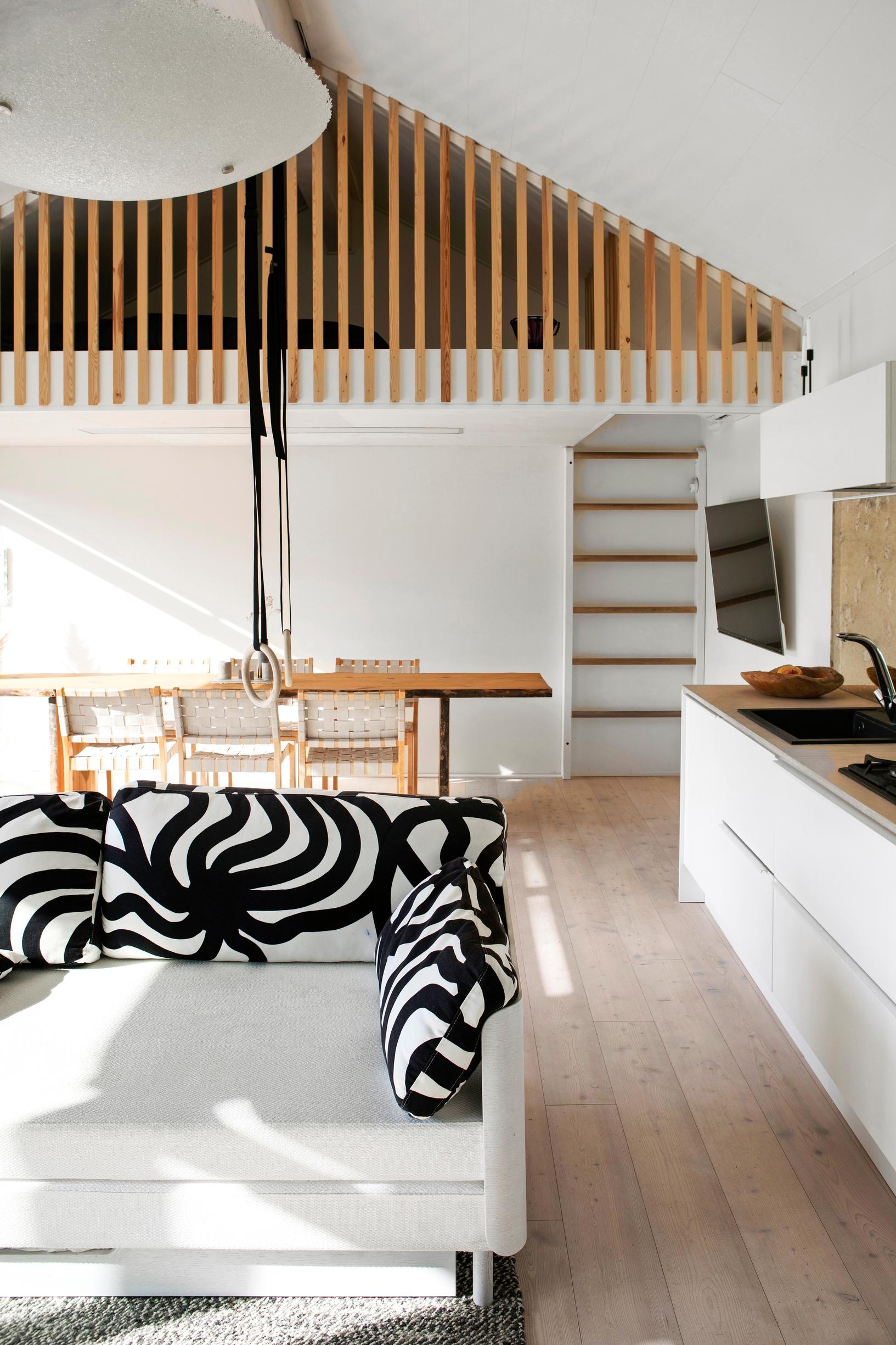 The sauna building’s living area is bright and functional