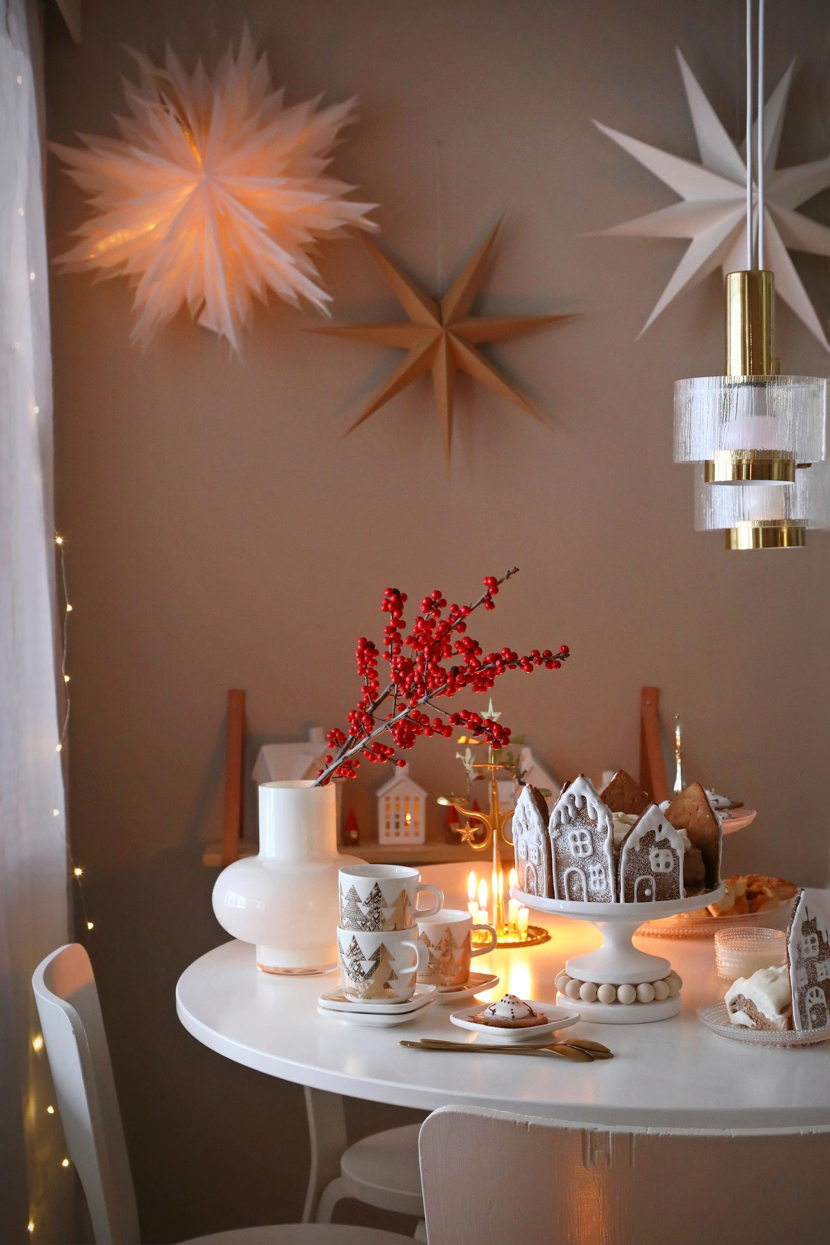 A Christmas table setting with a cake
