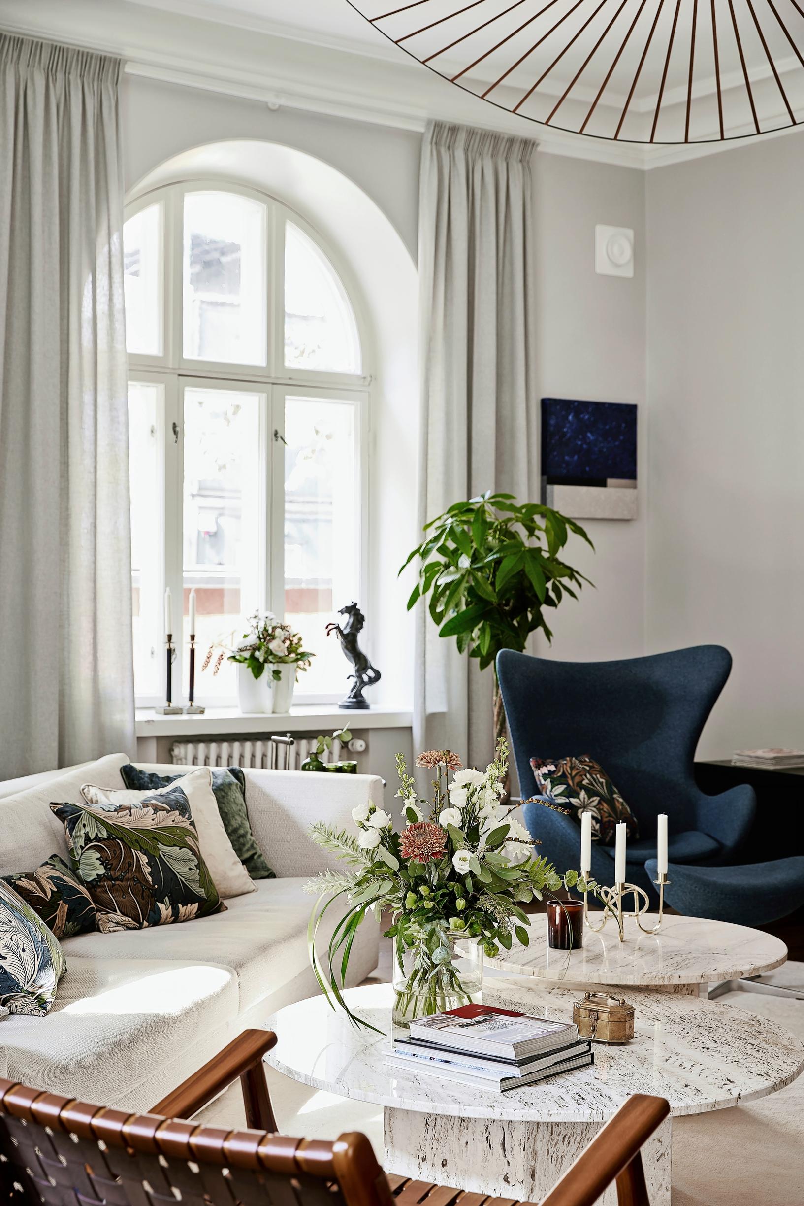 Gubi coffee tables paired with a Ligne Roset sofa