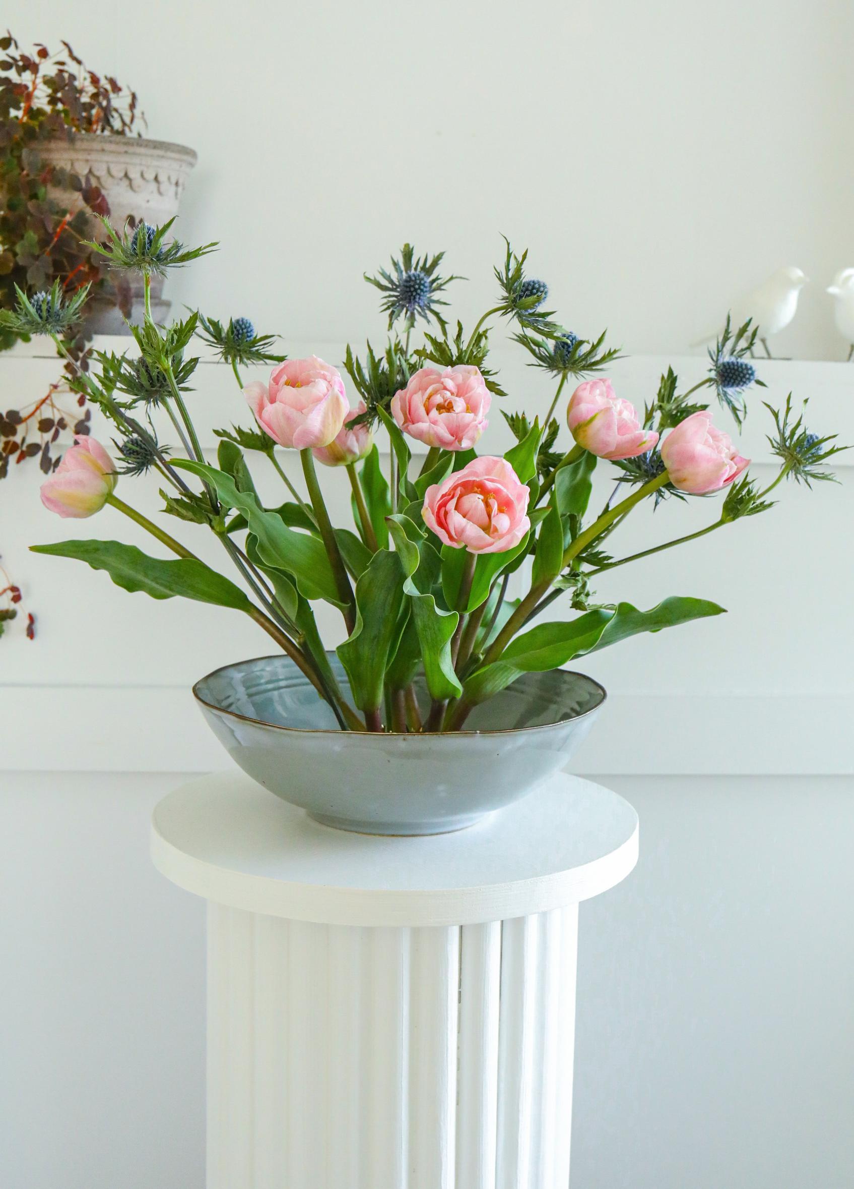 Cut flower arrangement made with a pin frog