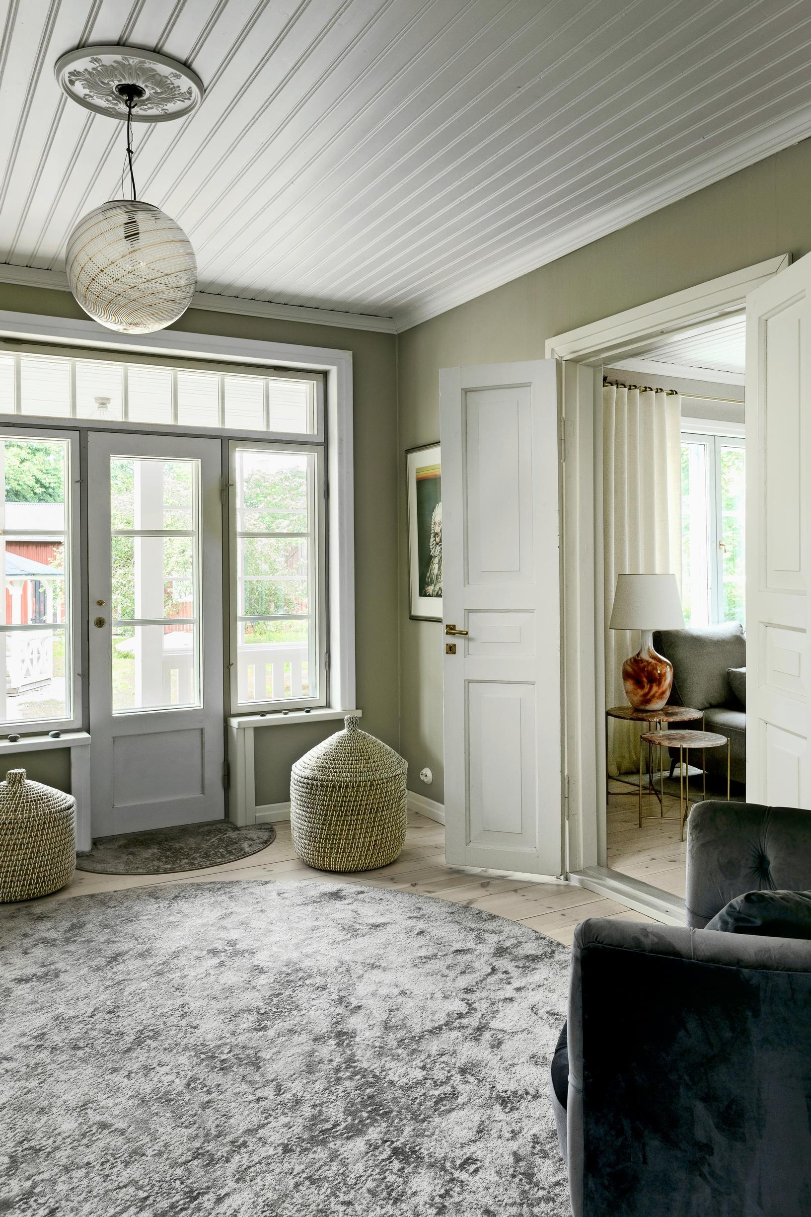 entry hall with a glass door and storage baskets