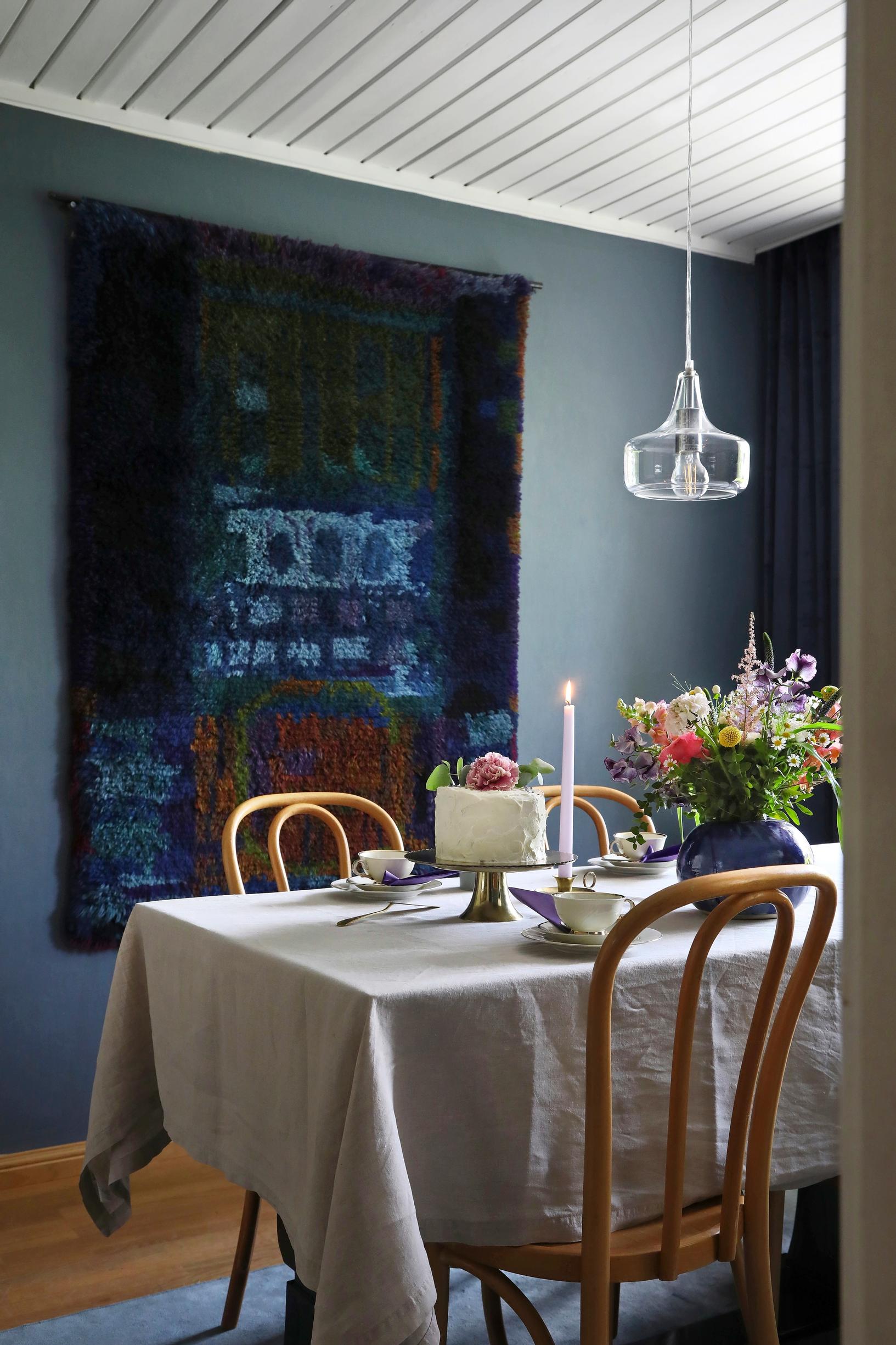 Photo of a coffee setting and Ritva Puotila's wall ryijy.
