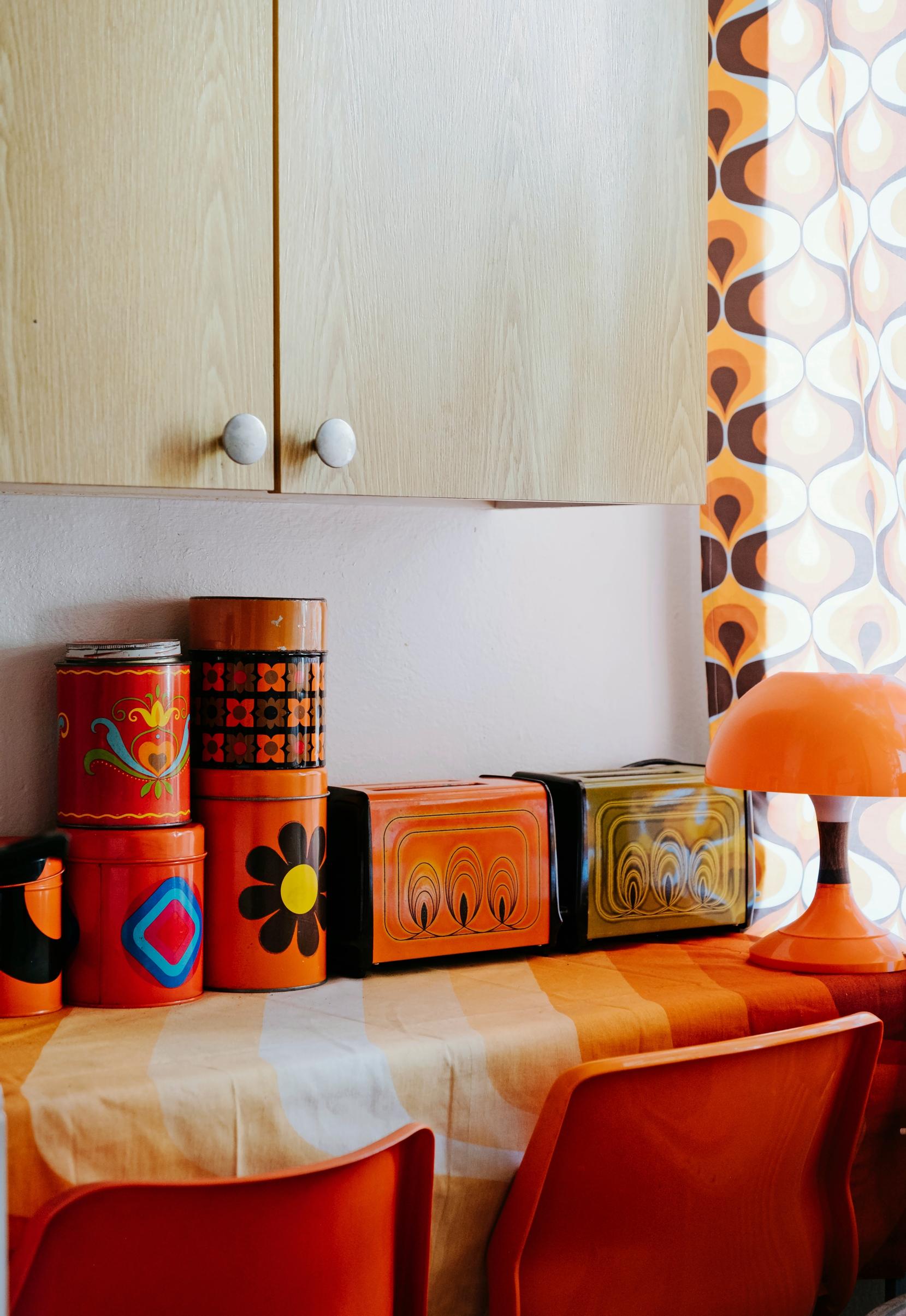 Photo of a vintage collector’s stash, with tin canisters and two toasters.