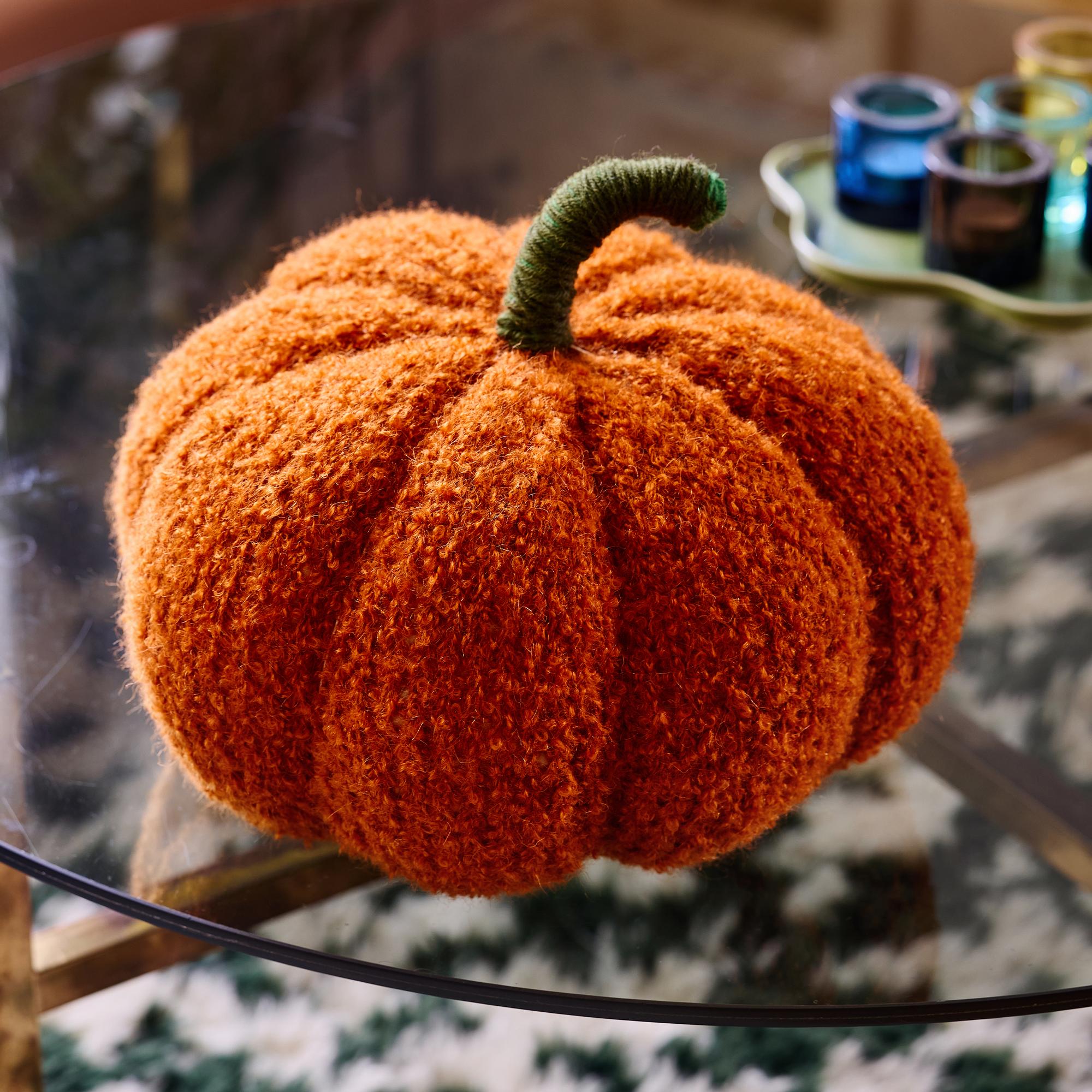 Fall for this plush pumpkin pillow—so easy to knit