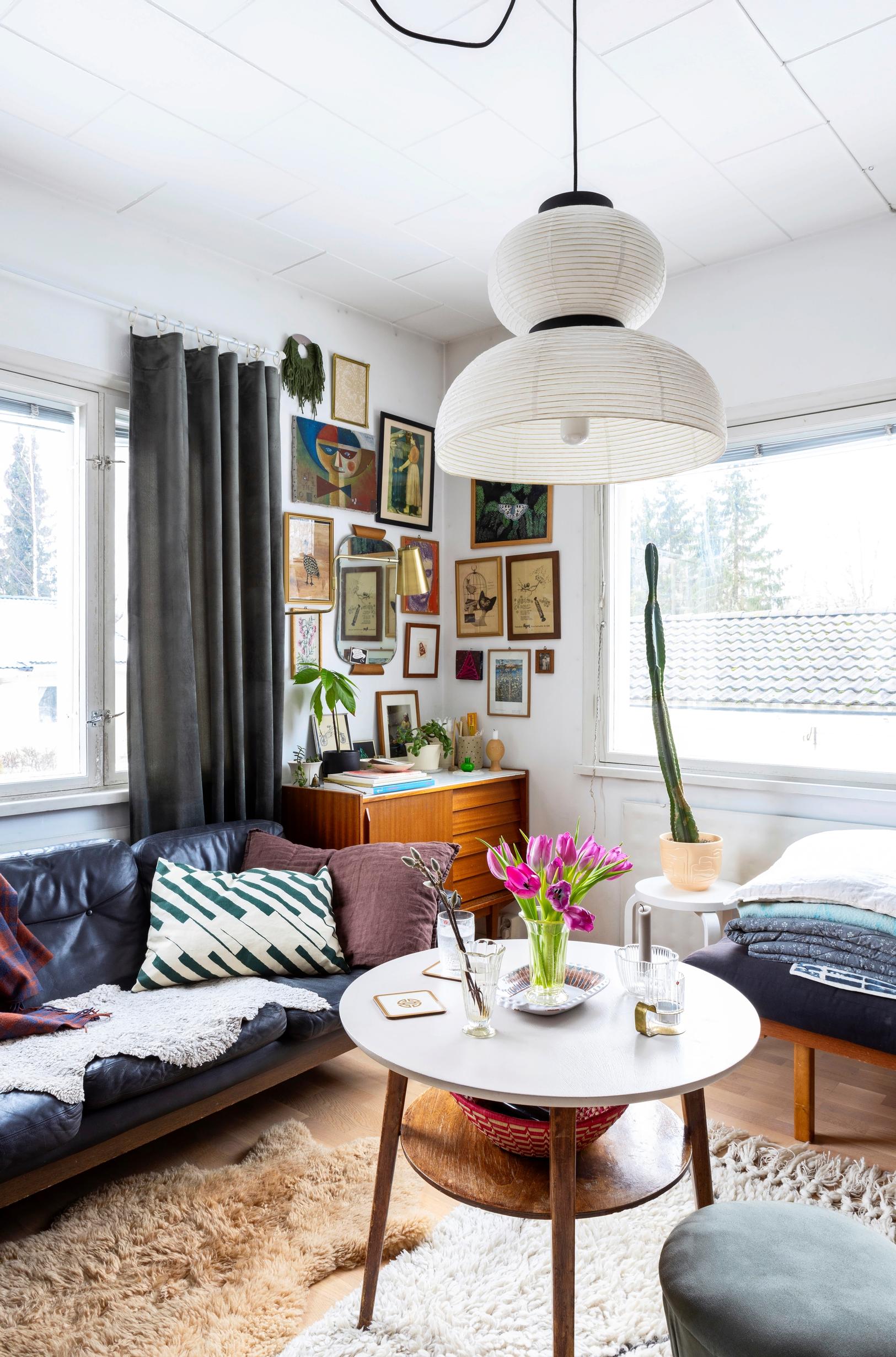 A leather sofa and a picture collage in the living room