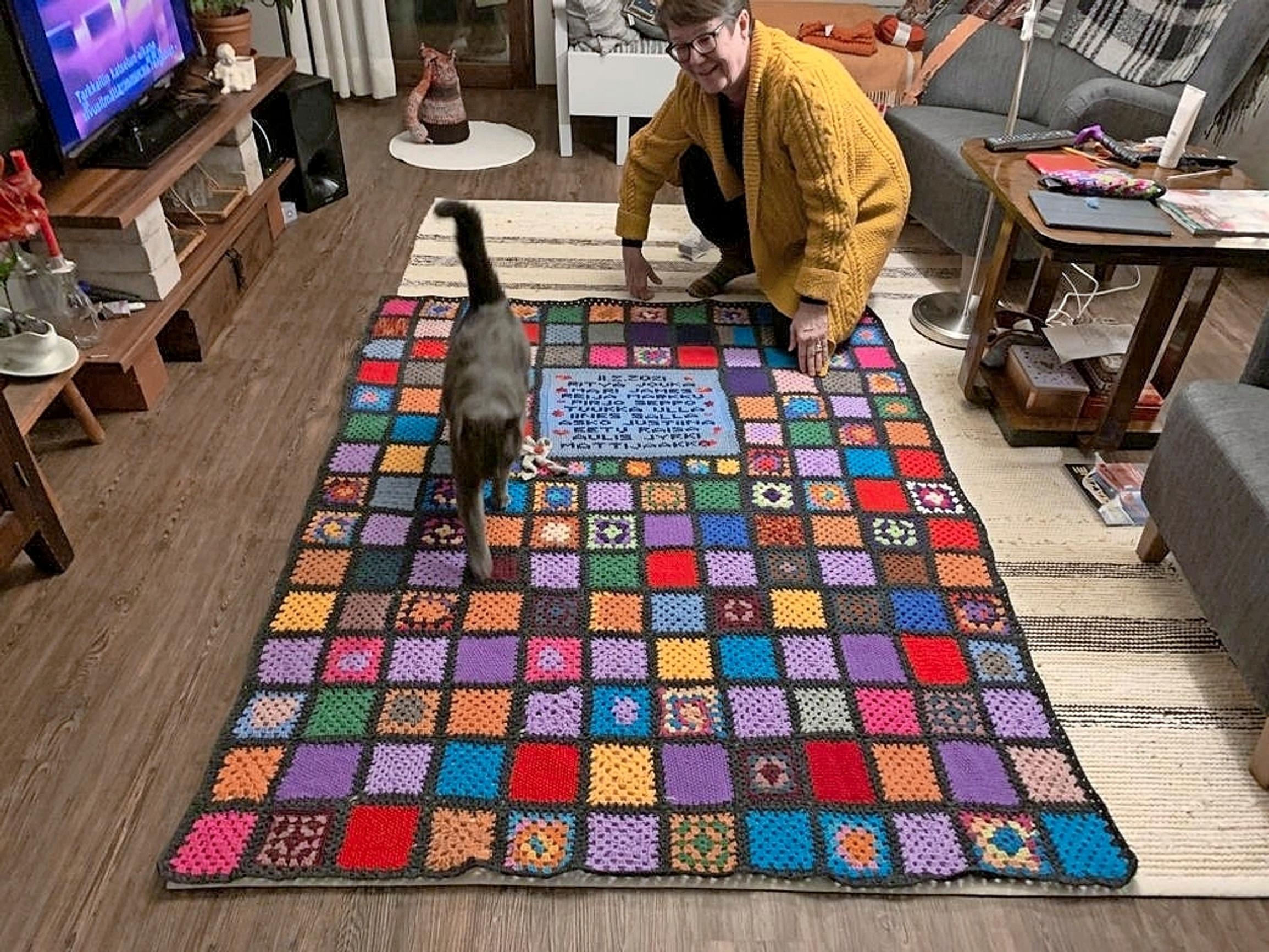 Pirjo and the finished family blanket.