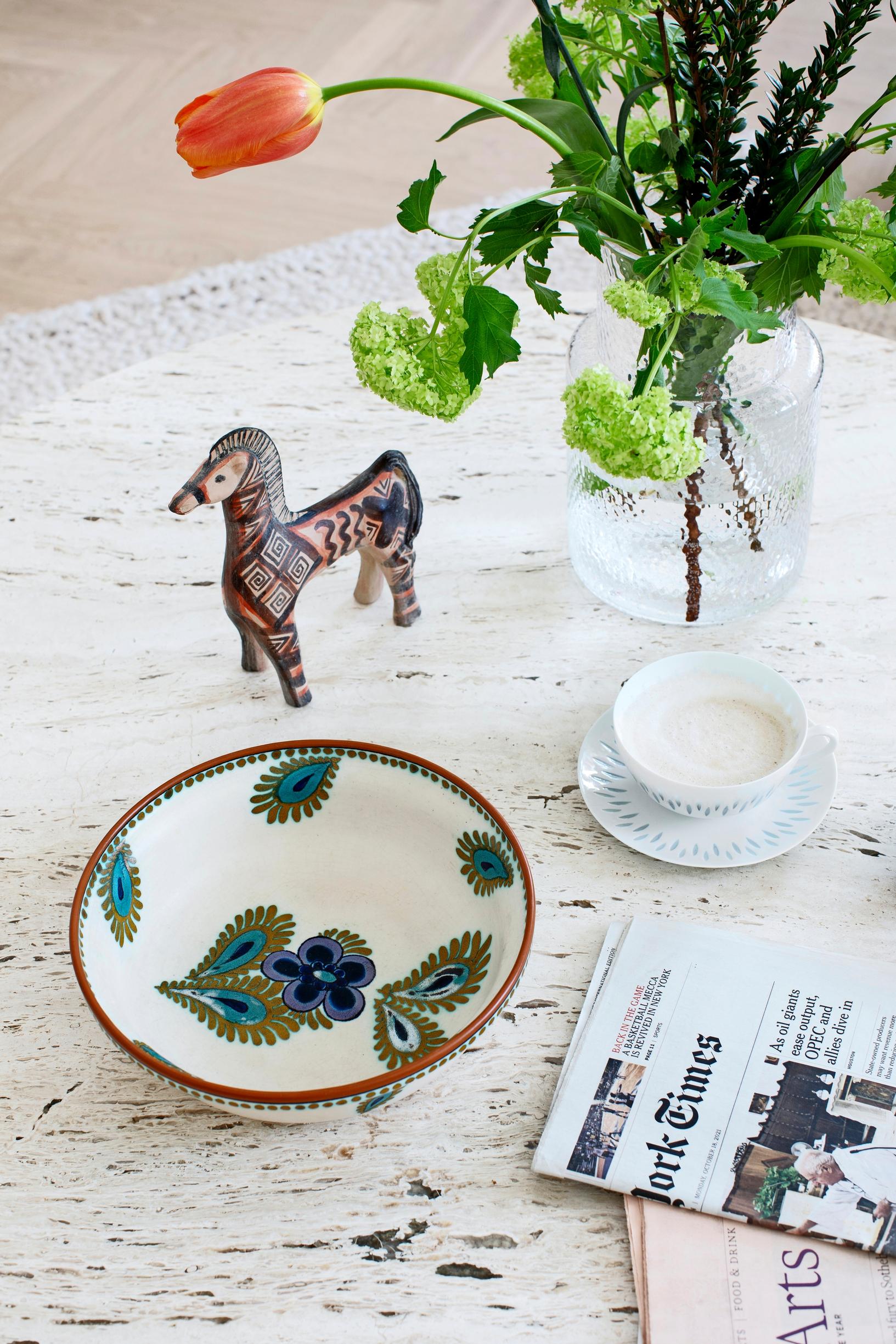 Rice porcelain dishes and an heirloom bowl on the coffee table.