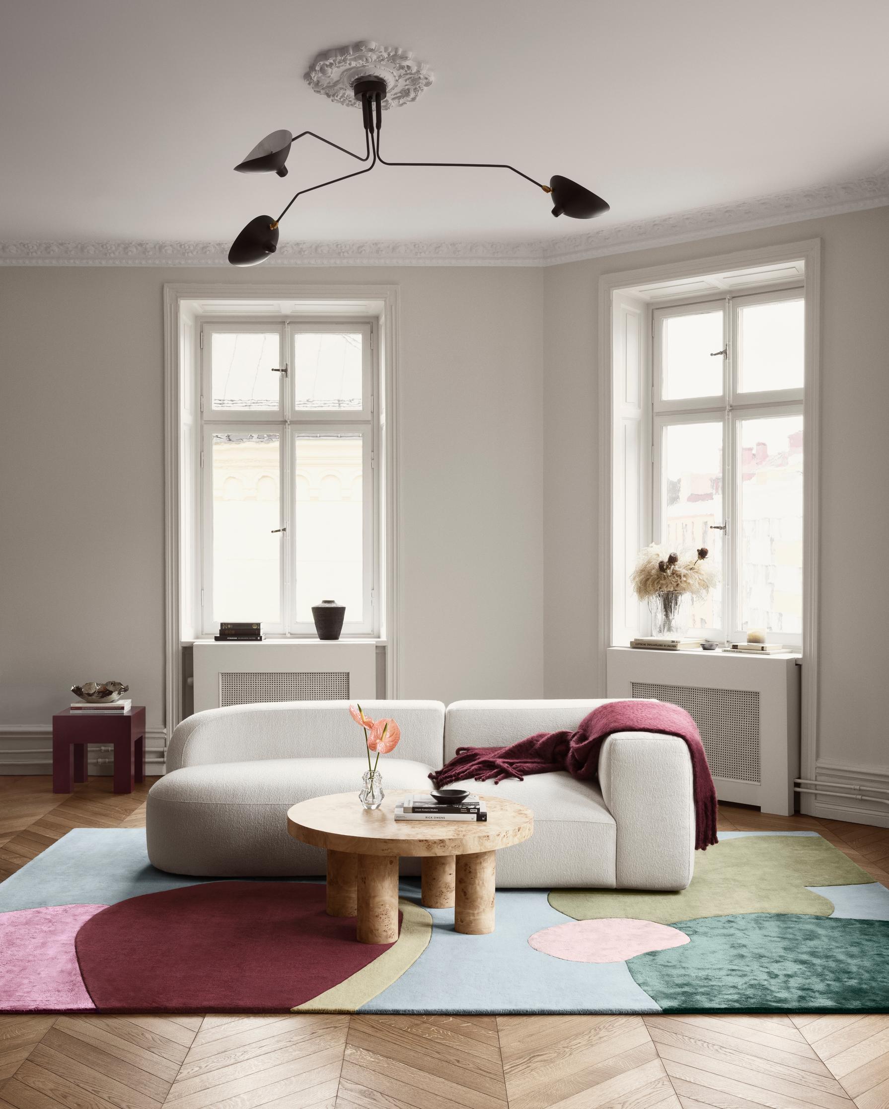 A colorful wool rug that takes center stage in the living room.