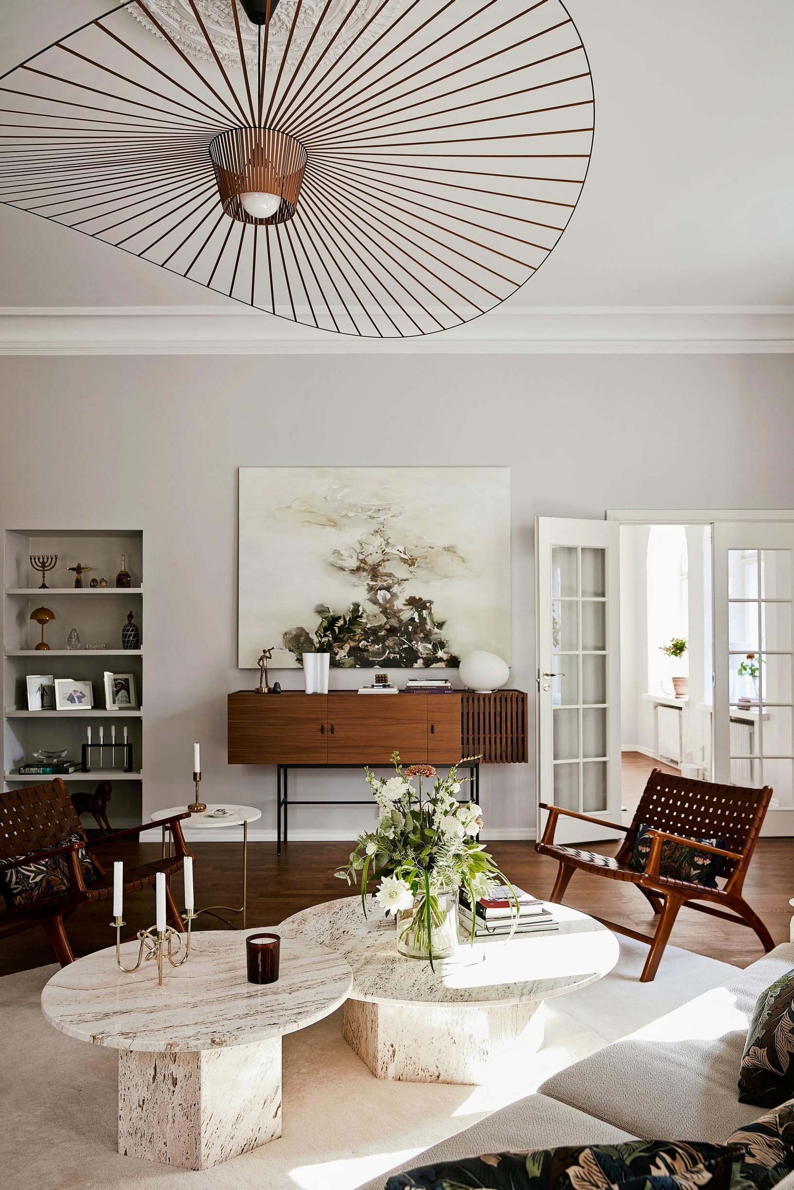 A large painting above the sideboard in the living room