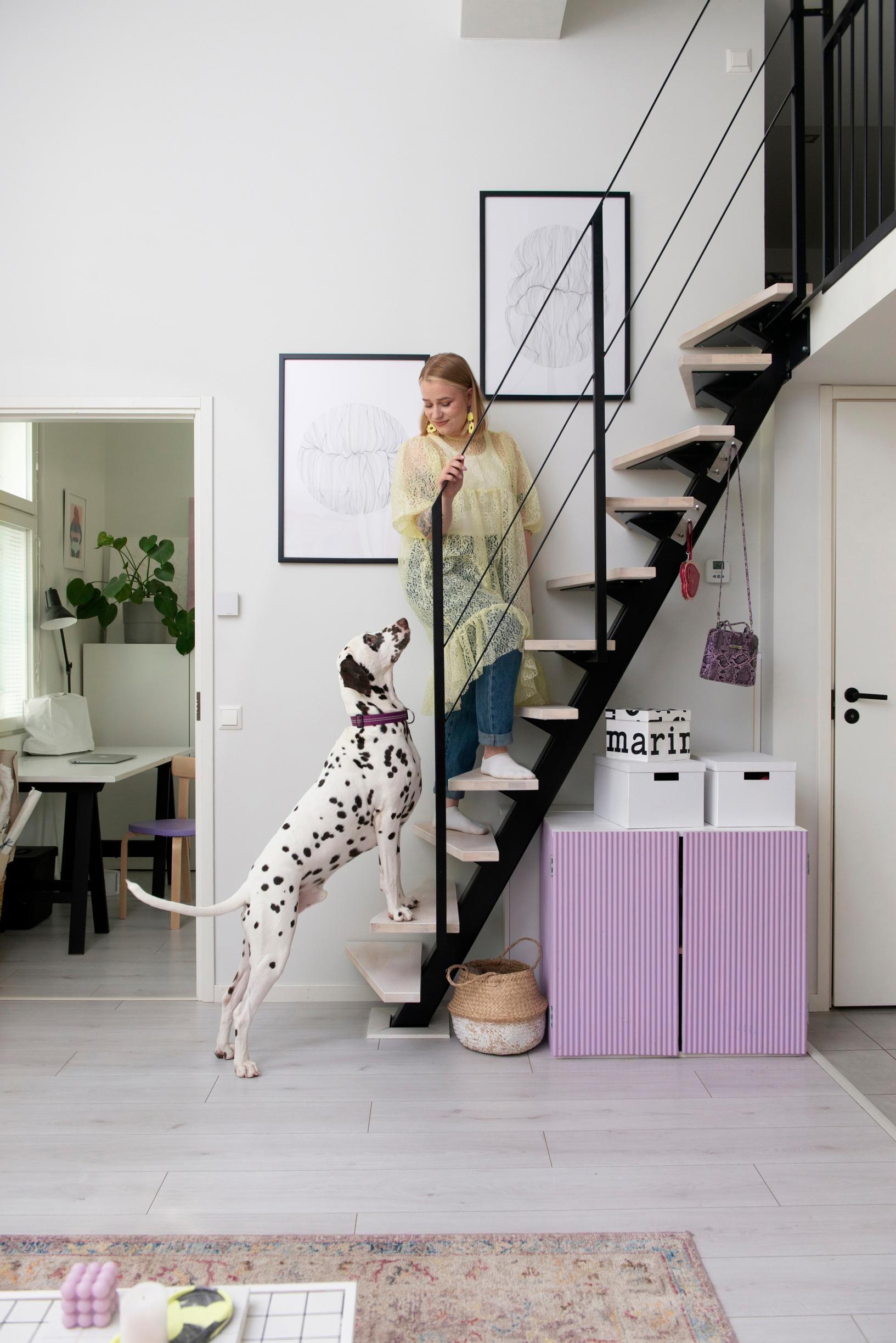 Inka Tikkinen walking up the stairs