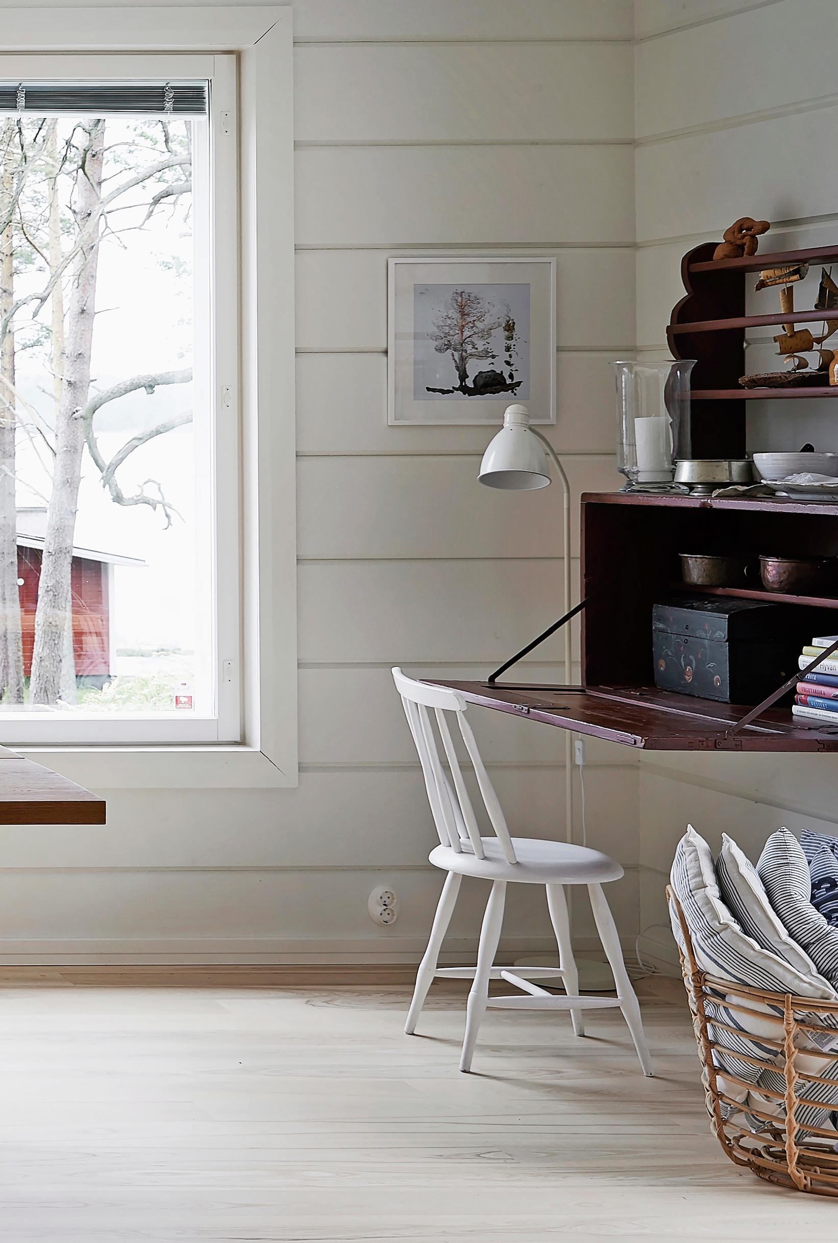 A workstation created from an old open shelf and a wall-mounted chest of drawers.
