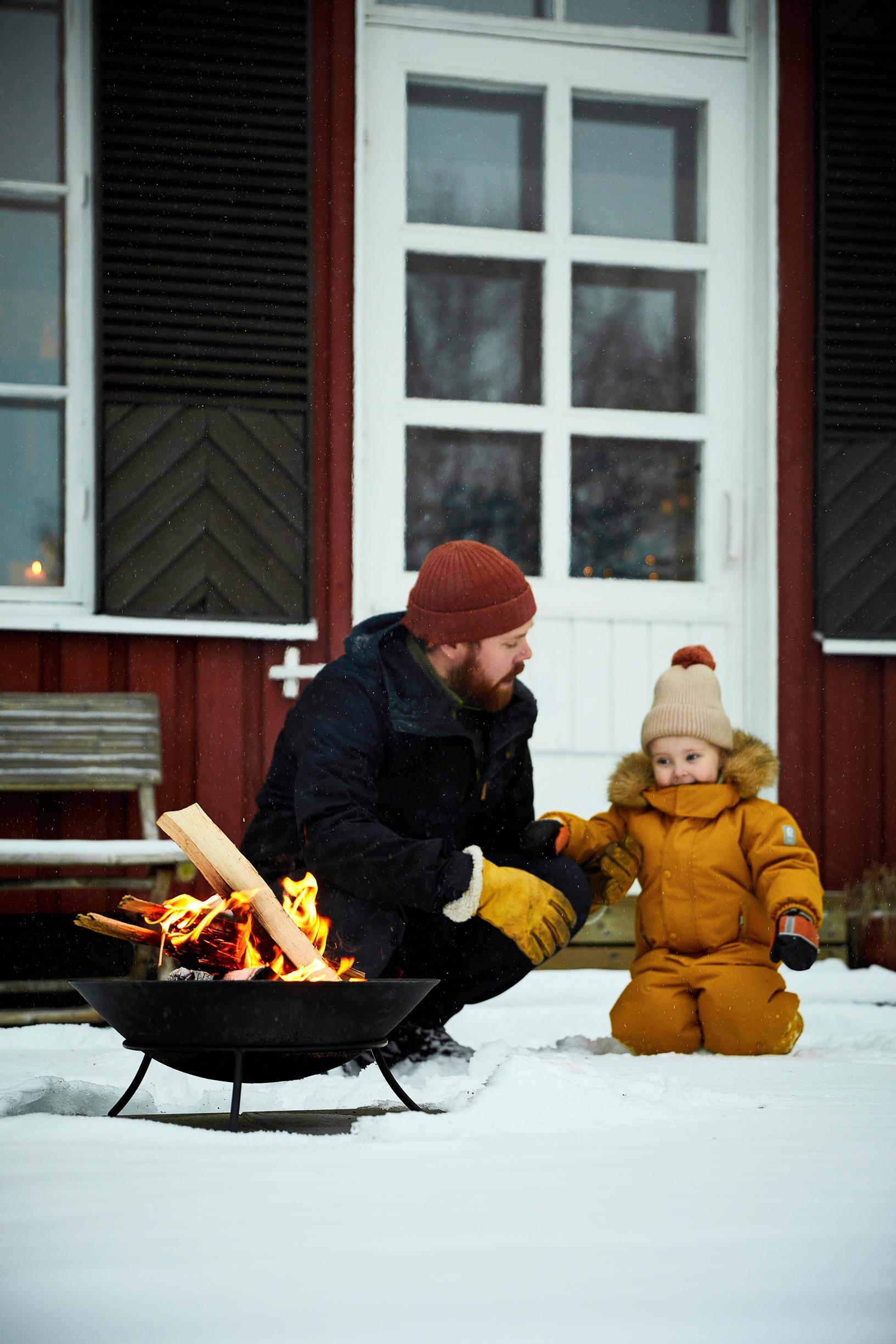 Rabbe and Vilja by the fire bowl.