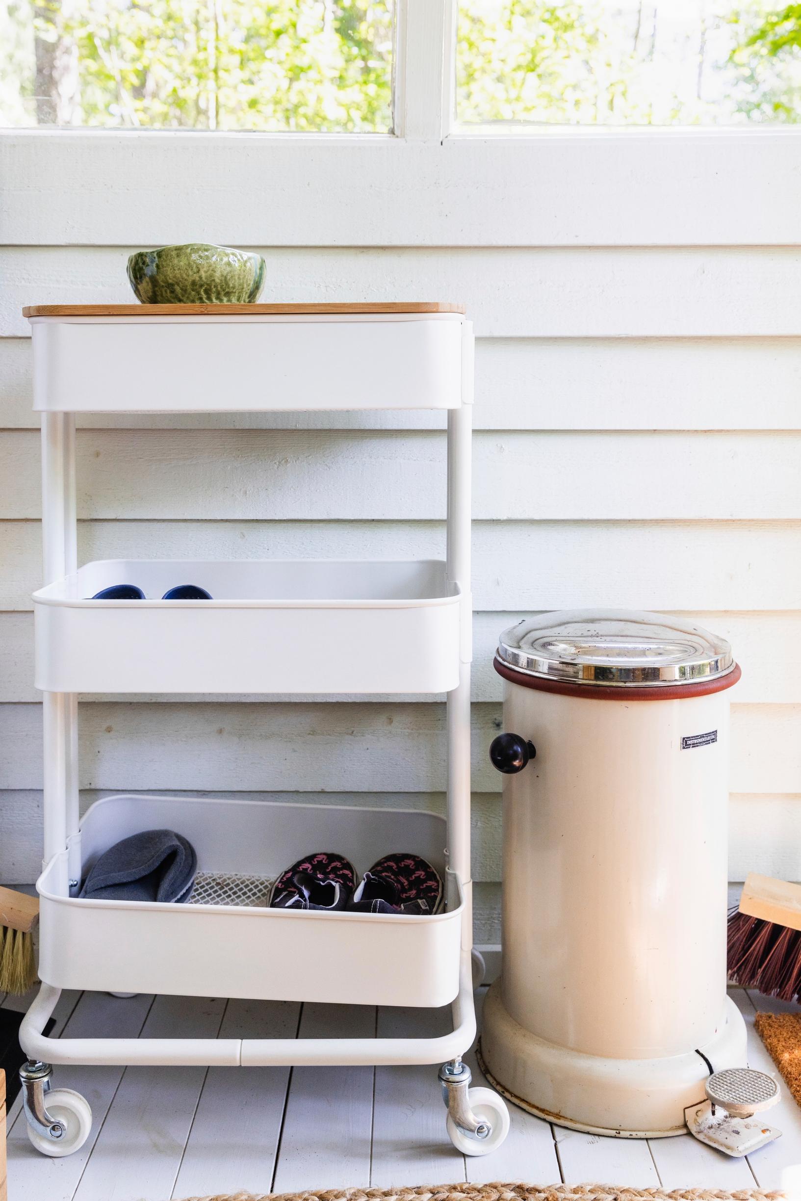 a utility cart and trash bin