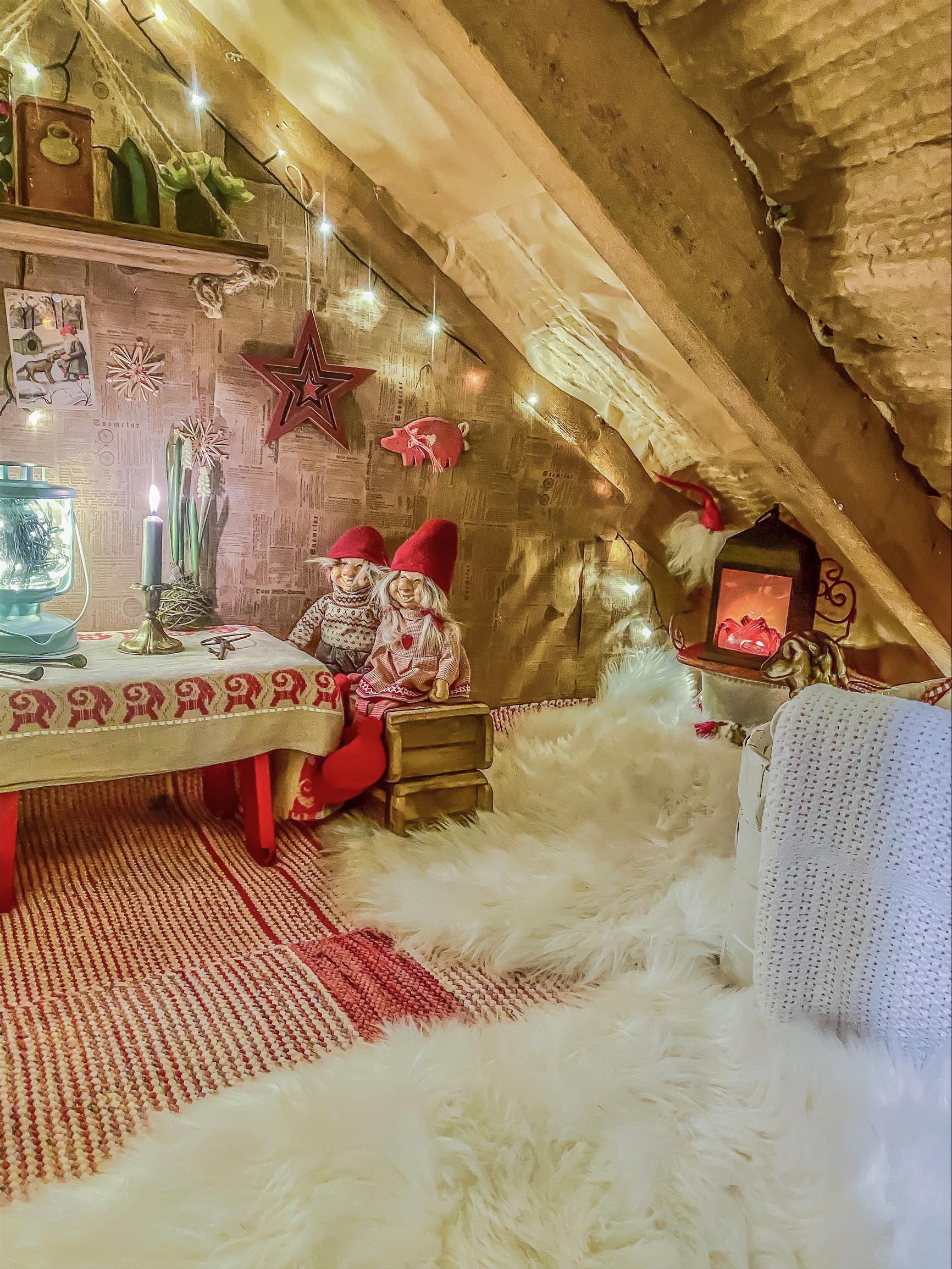 A cozy, sloped-ceiling elf cottage under the stairs.