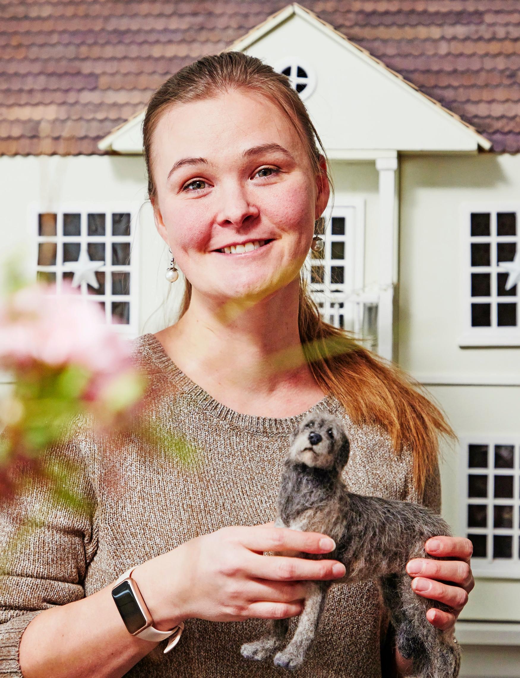 Emilia holding a felted dog.