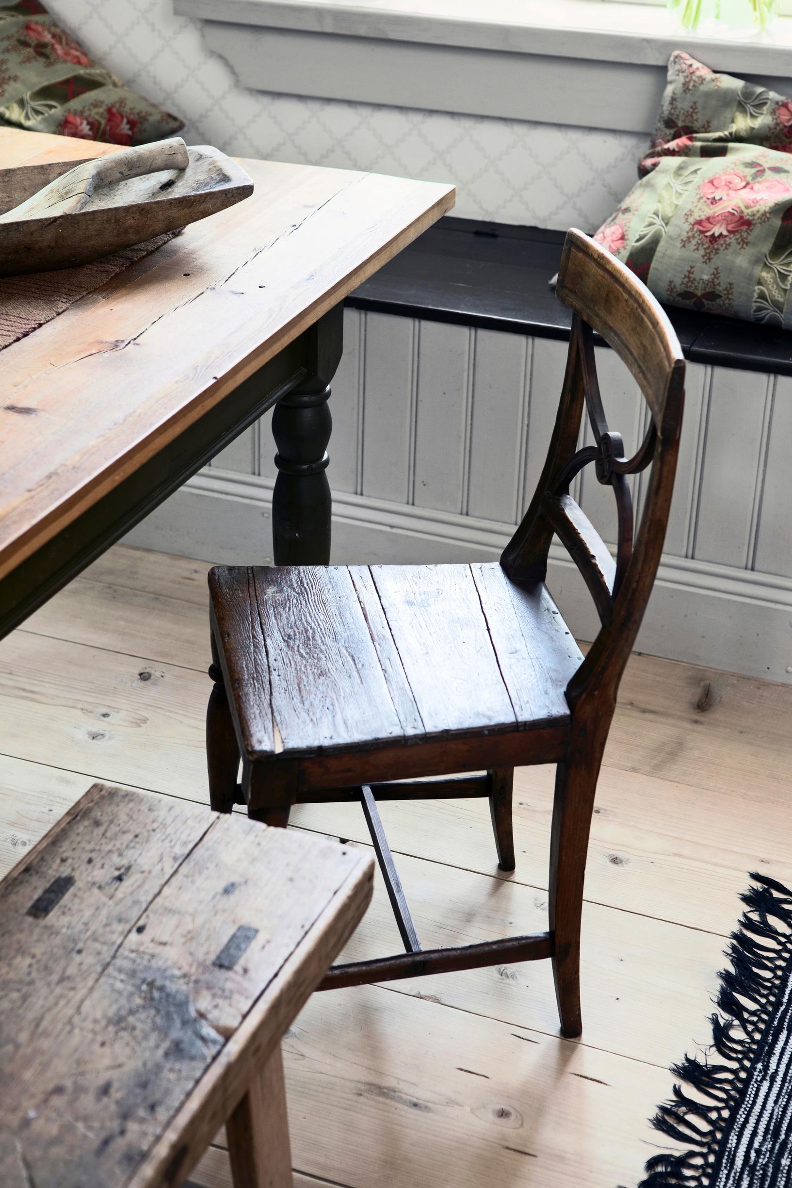 An ornate antique chair by the dining table