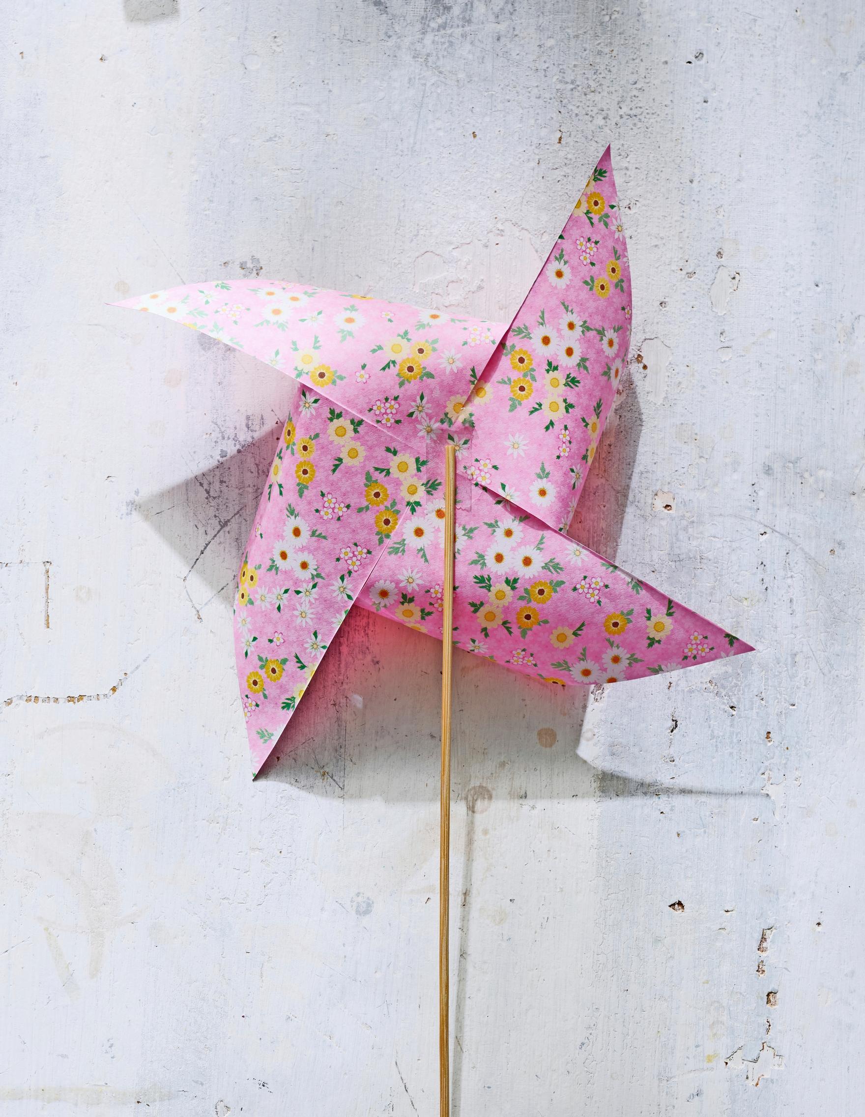 A skewer is glued to the back of the pinwheel.