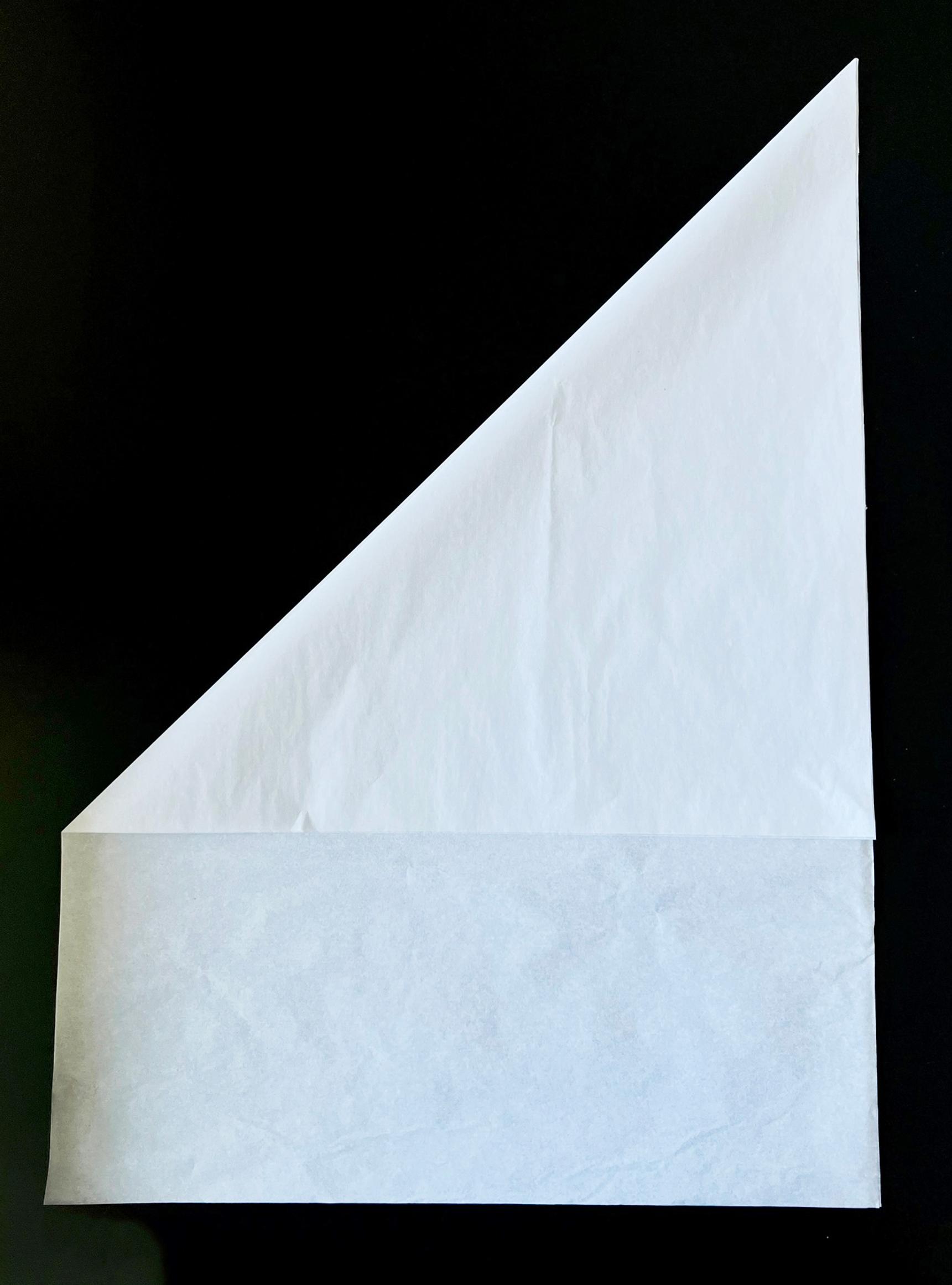 Folding the fringe star’s paper diagonally in half