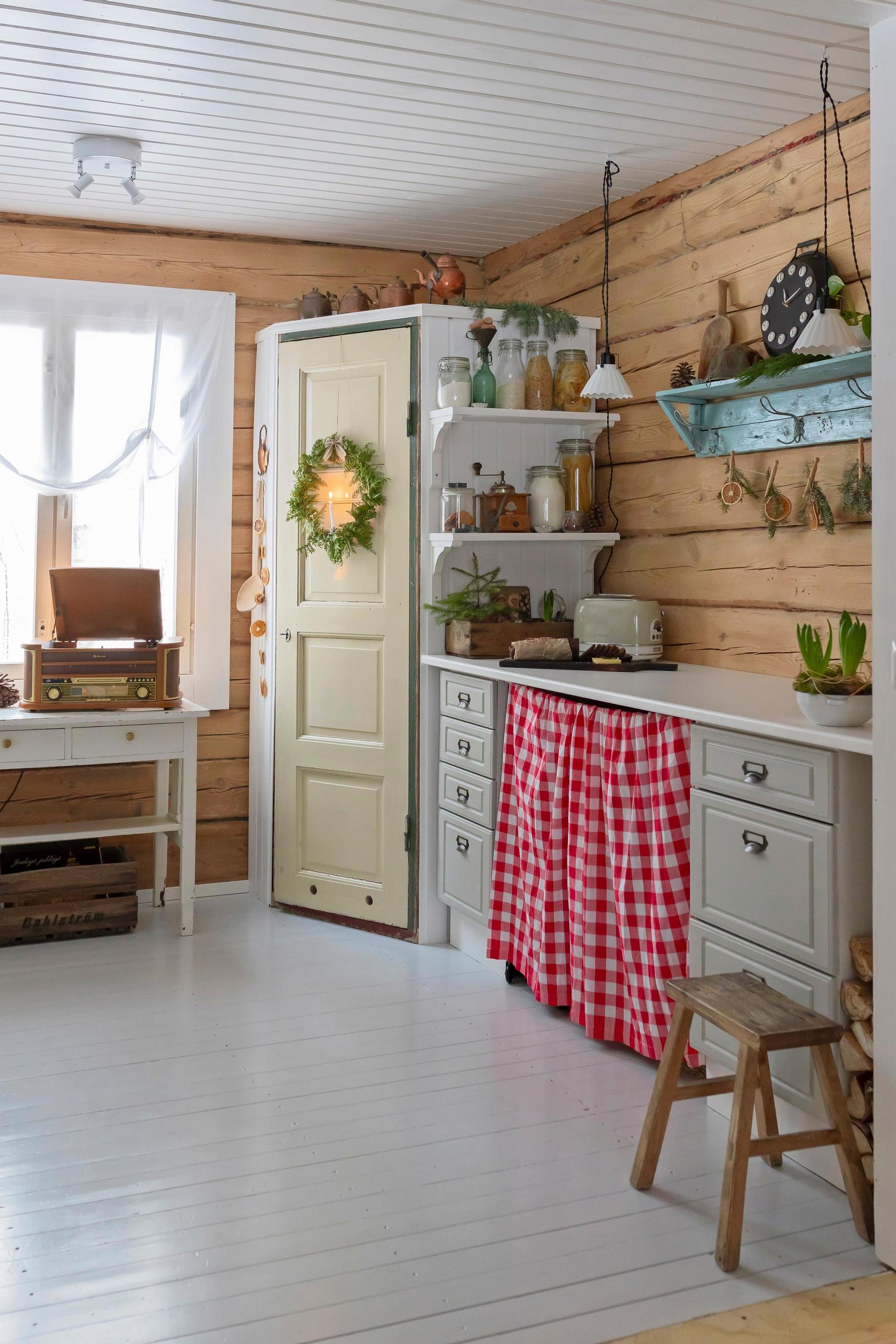 A kitchen with a pantry