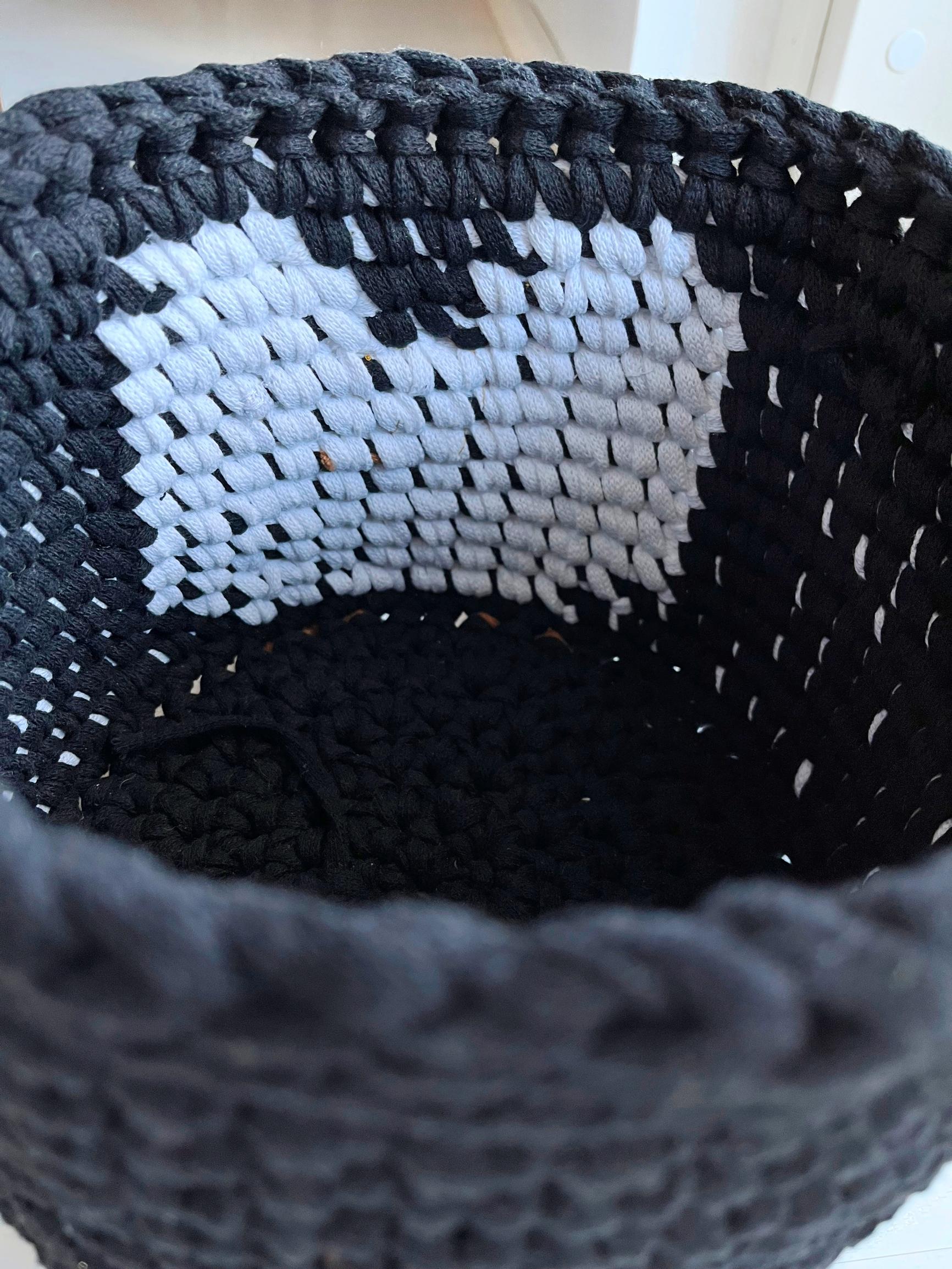 The colorwork interior of the penguin basket.
