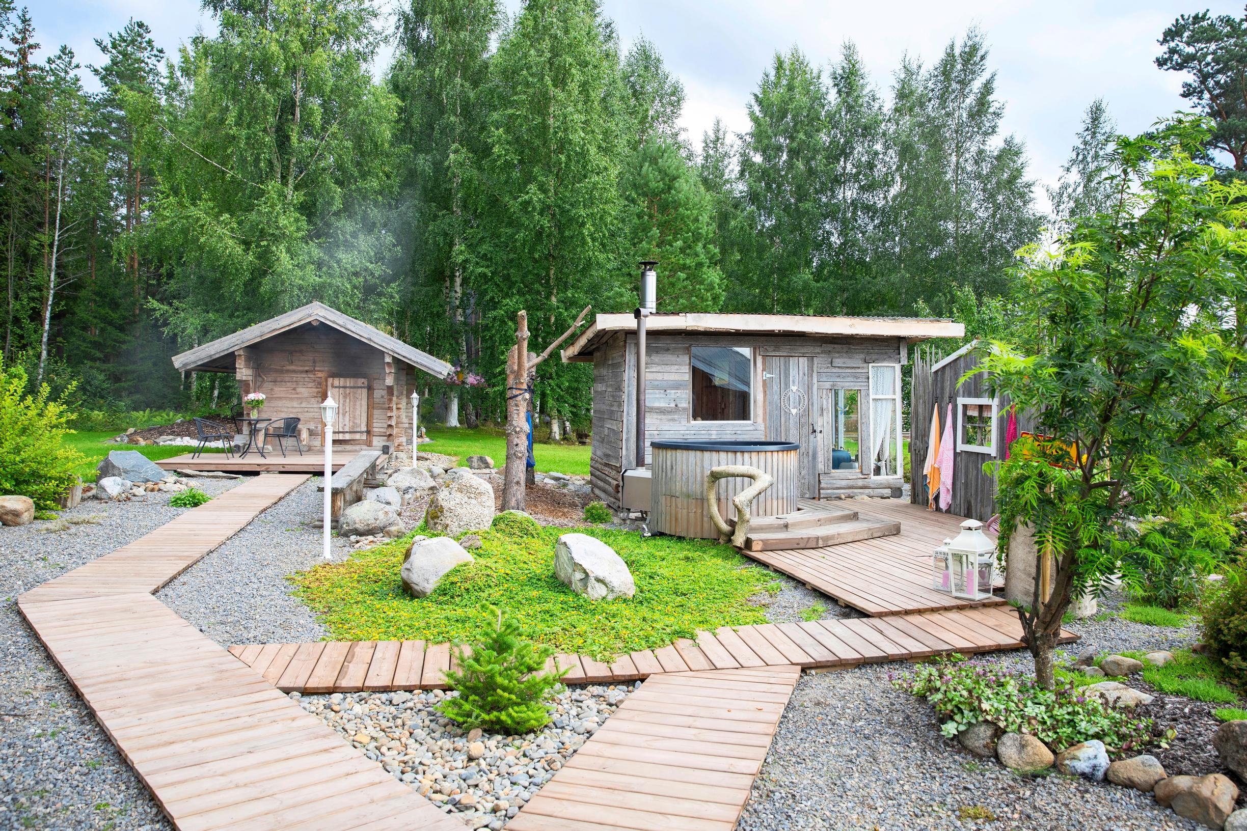 An old smoke sauna, a sauna made from a barn, and an outbuilding in the yard
